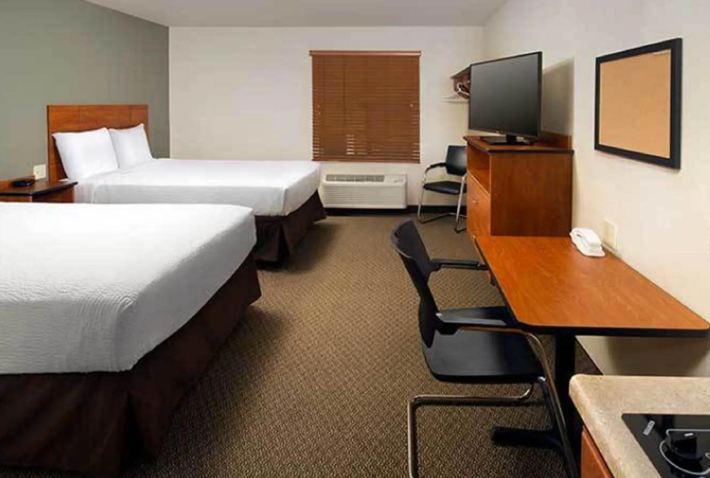 Bedroom, Bed in WoodSpring Suites Allentown