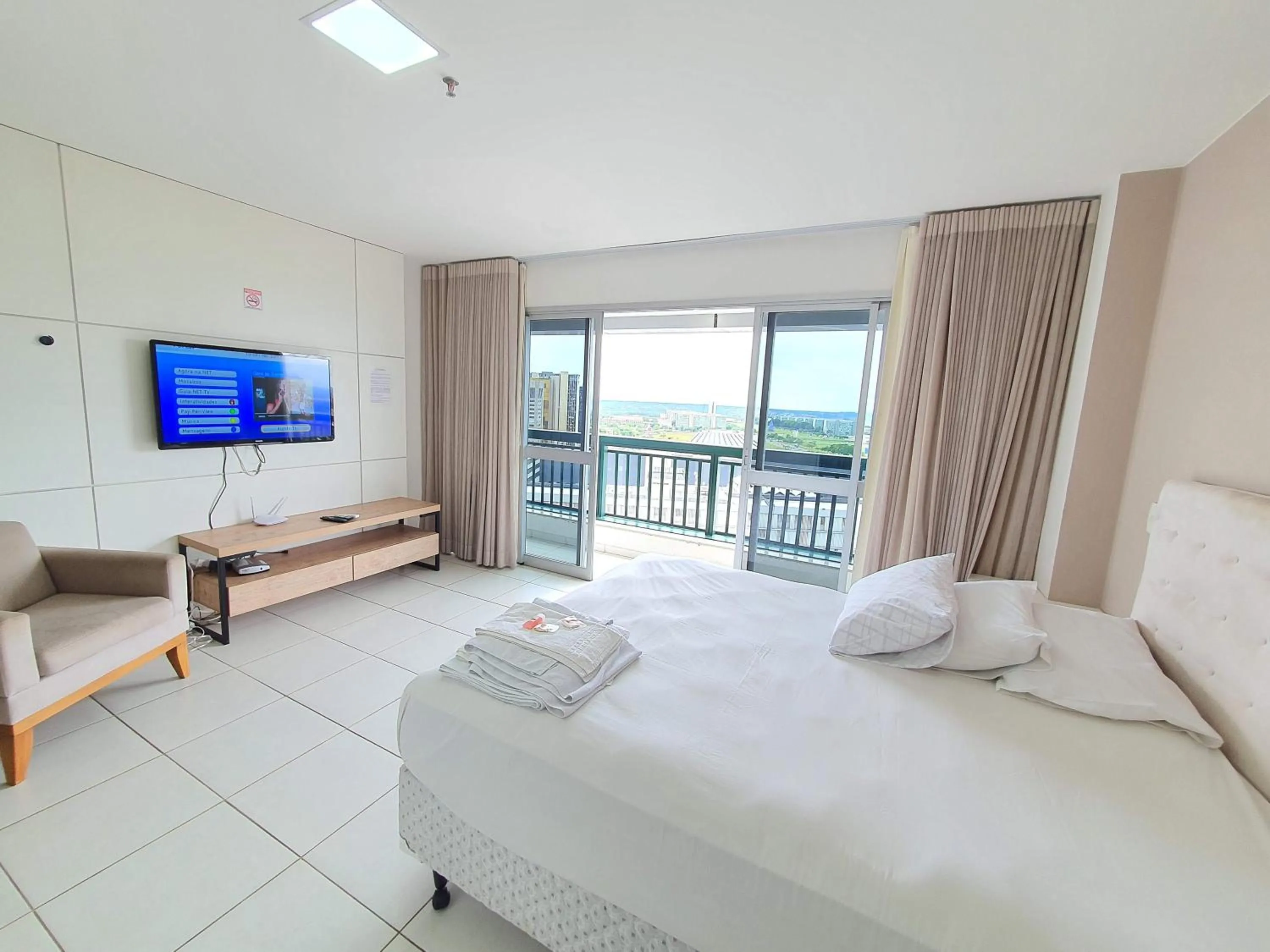 Communal lounge/ TV room, Bed in Flat Vision Executivo Premium By Rei dos Flats