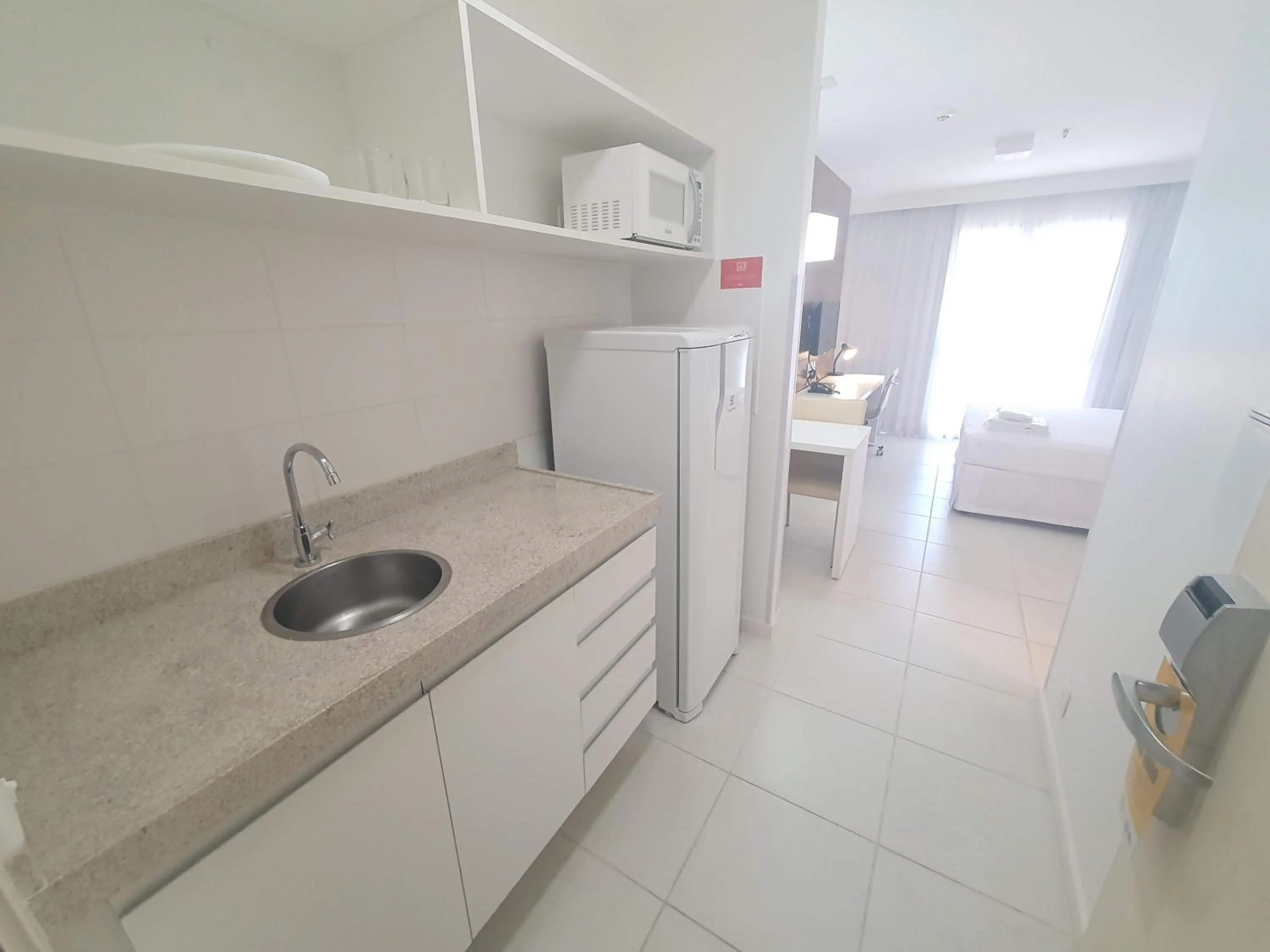 Kitchen or kitchenette in Flat Vision Executivo Premium By Rei dos Flats