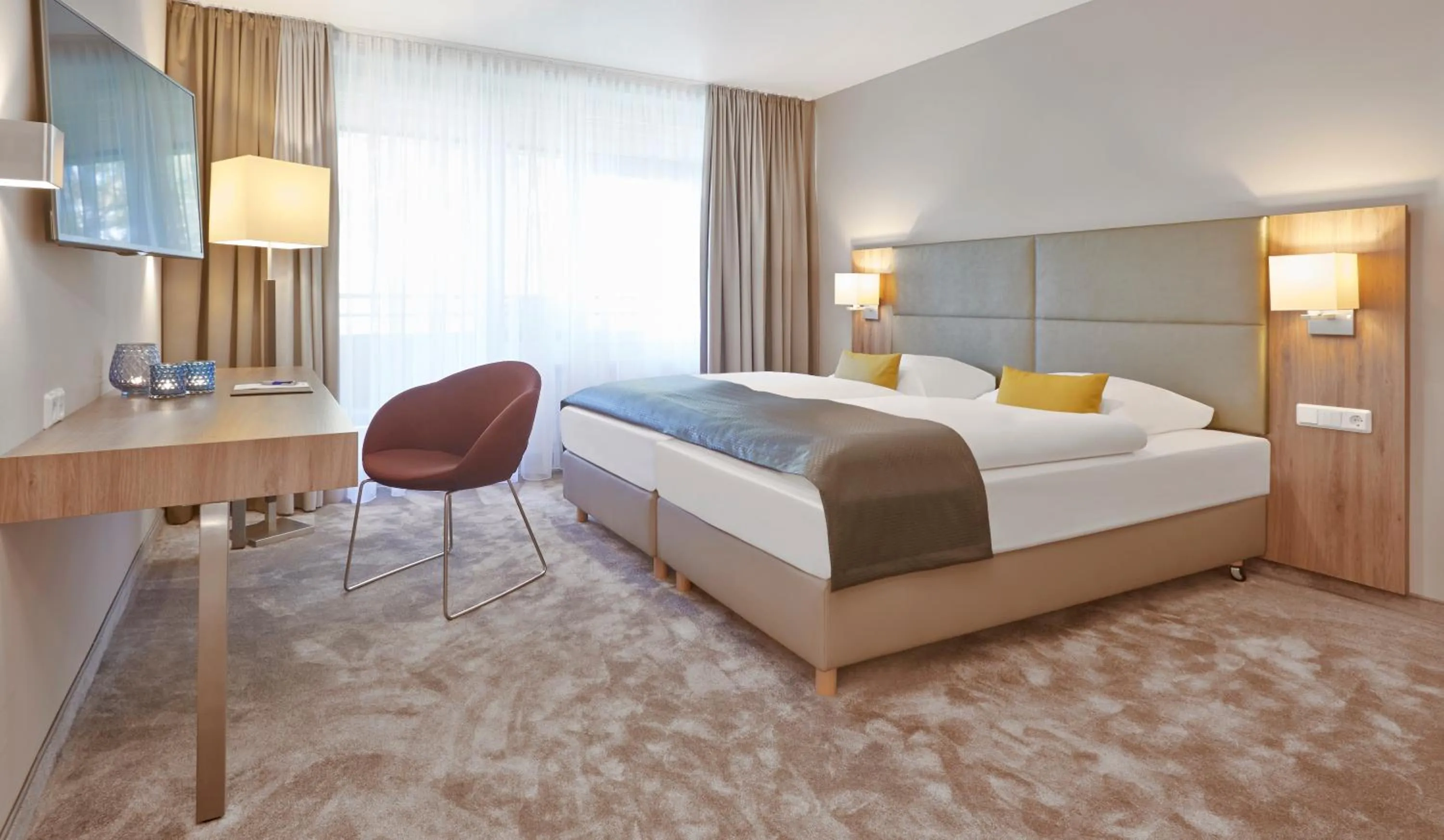 Bed in Upstalsboom Parkhotel