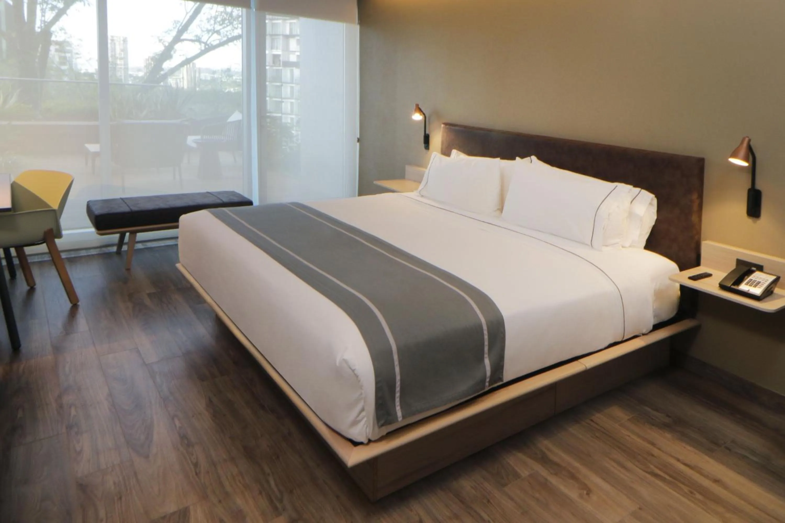 Photo of the whole room, Bed in City Express Plus by Marriott Guadalajara Providencia