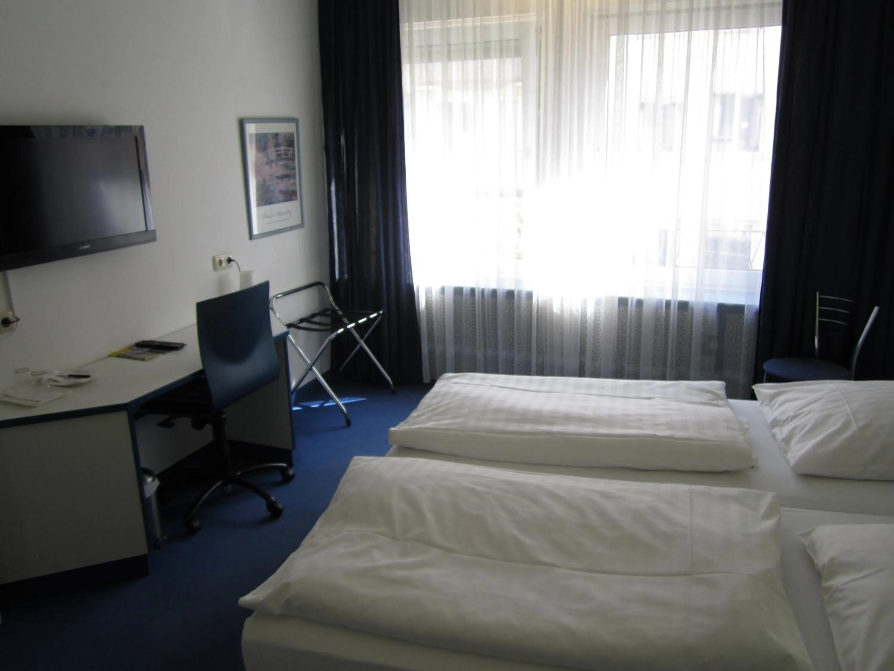 Photo of the whole room, Bed in Hotel City Kräme am Römer - Self Check In