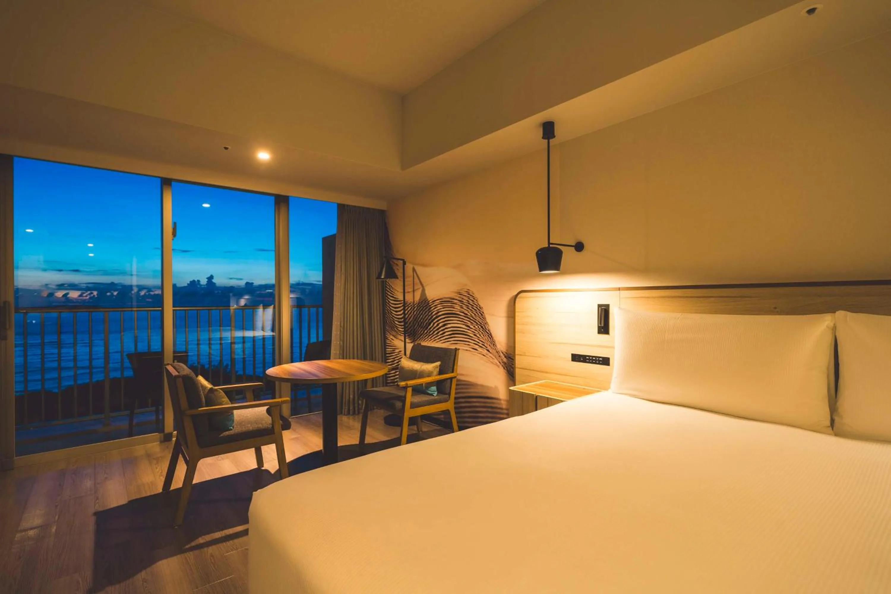 Living room, Bed in Hilton Okinawa Sesoko Resort