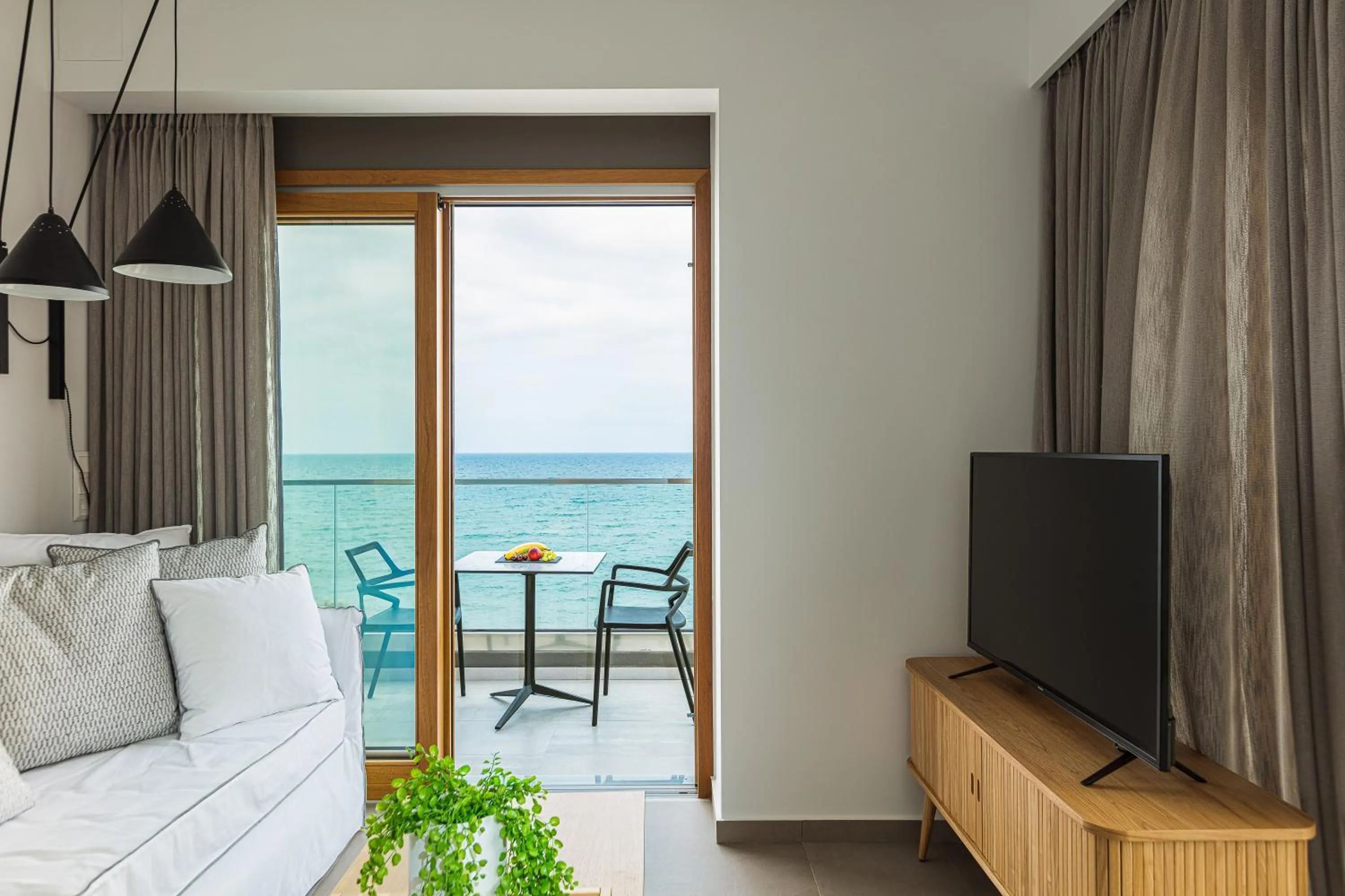 Seating area, Bed in North Coast Seaside Suites