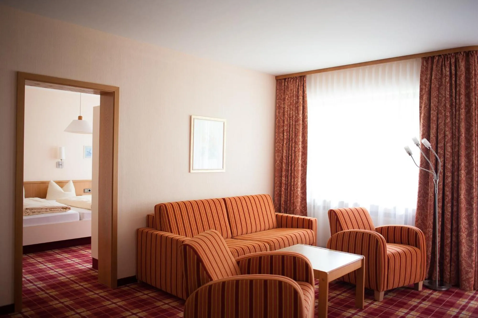 Living room, Bed in Hotel Berghof