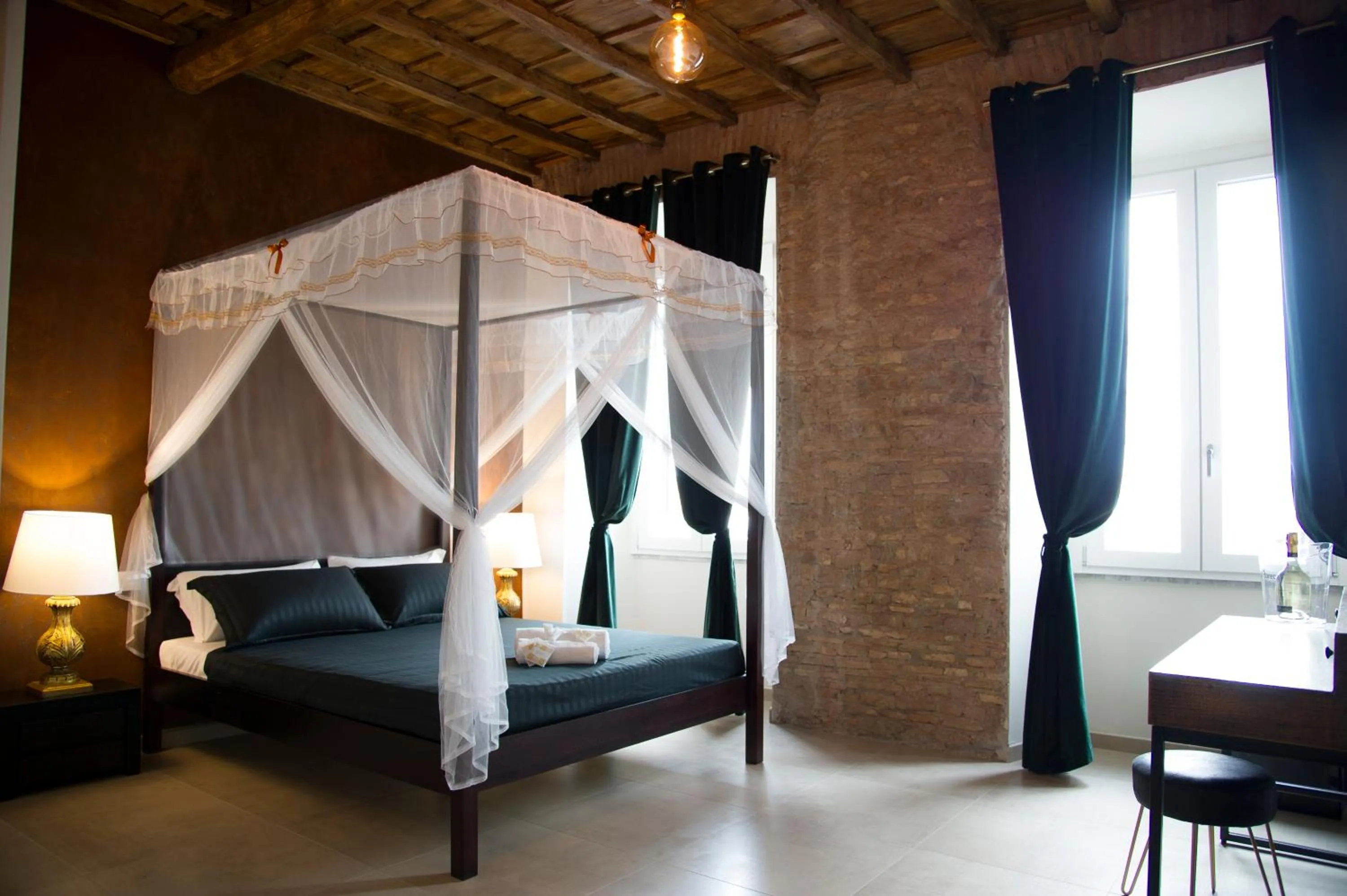 Bed in Le Boutique Luxury Rooms diffused in Historic Center
