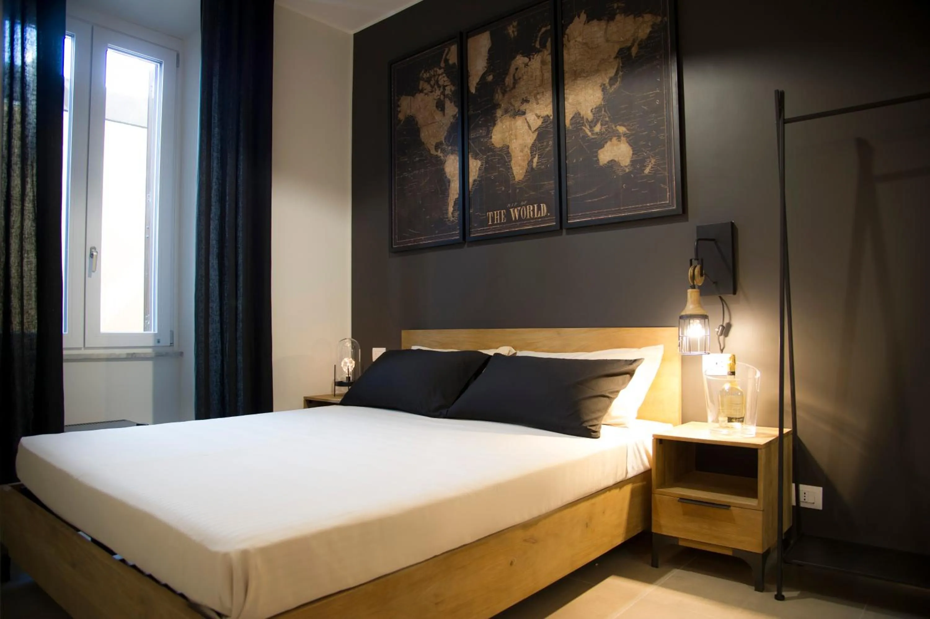 Bed in Le Boutique Luxury Rooms diffused in Historic Center