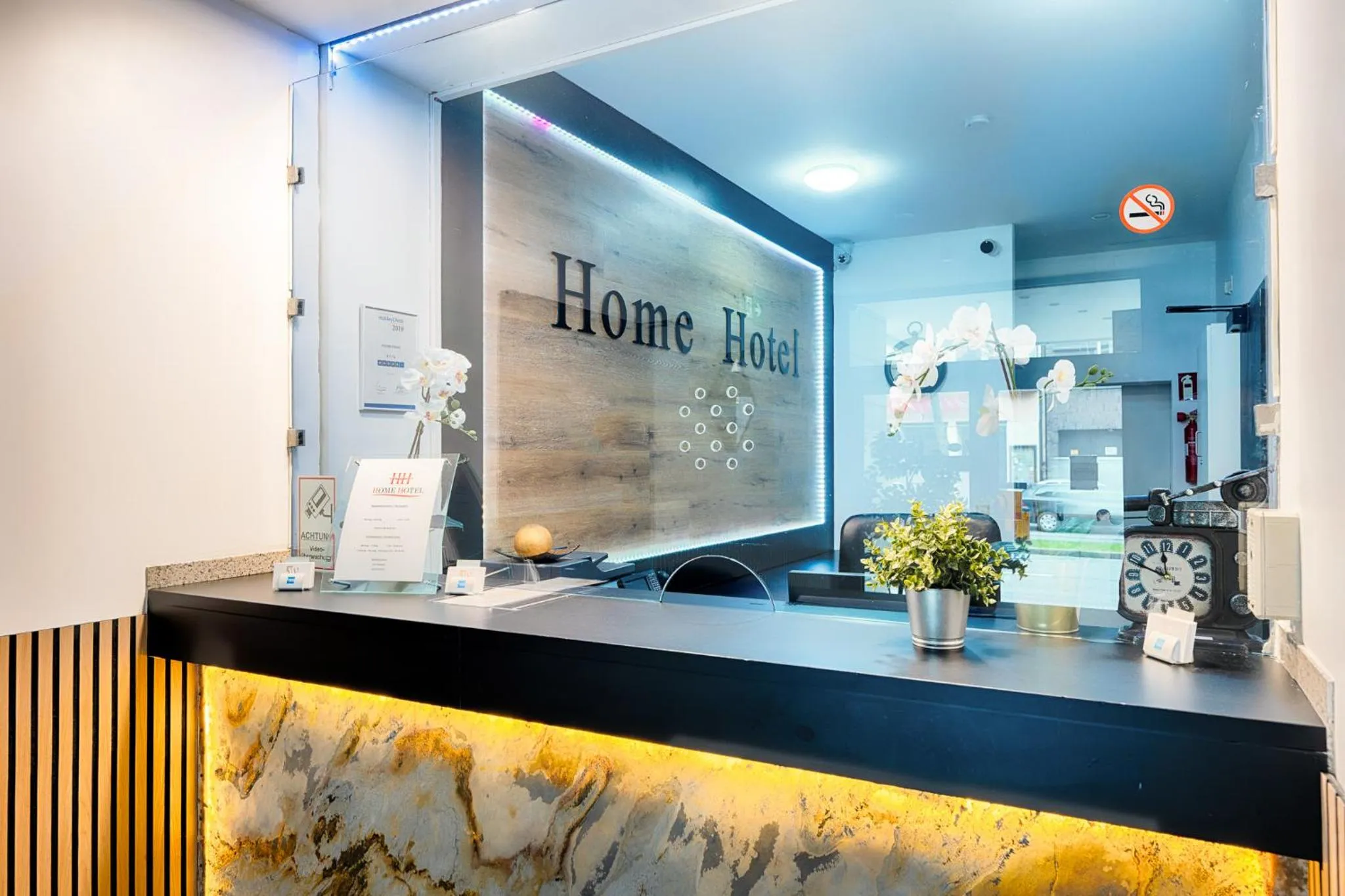 Lobby or reception in Home Hotel