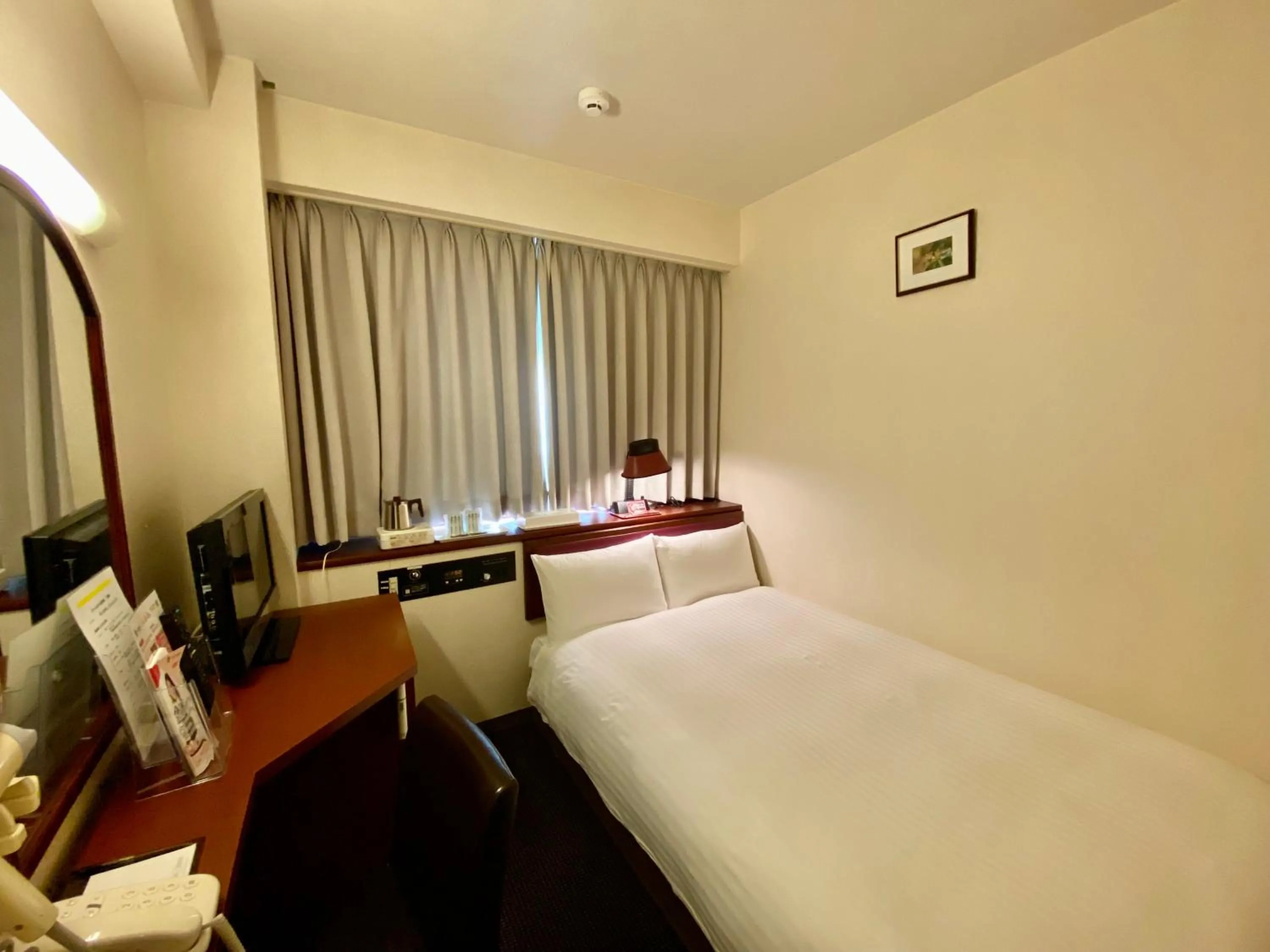Bed in Smile Hotel Sasebo