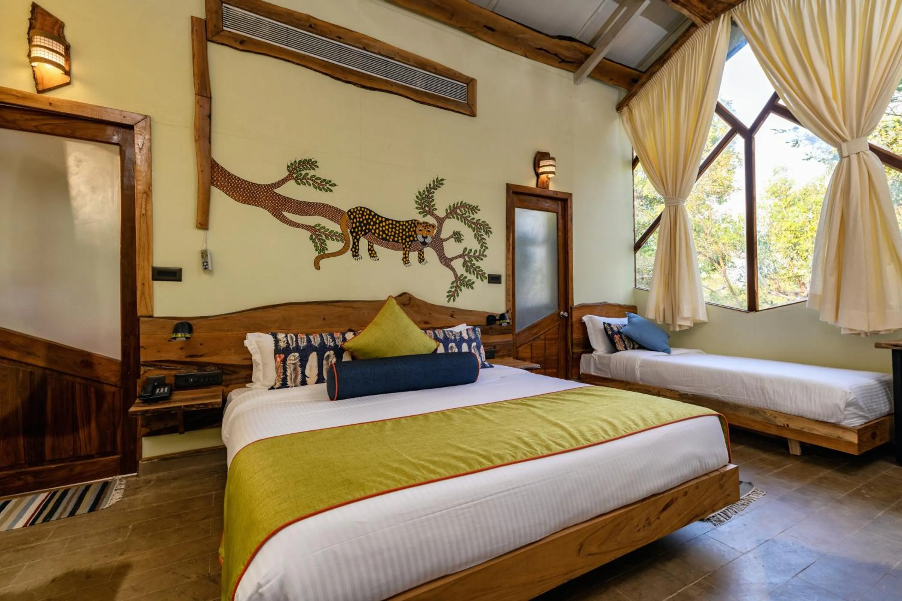Bed in Kanha Jungle Camp