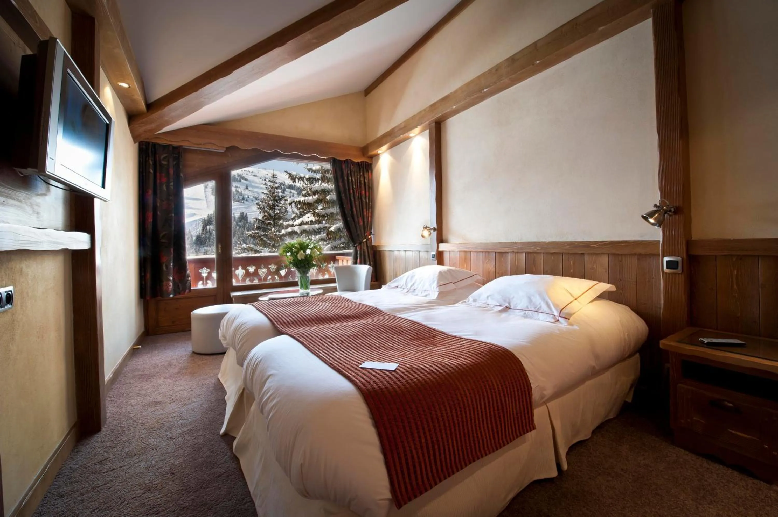 Bed in Hôtel Les Sherpas