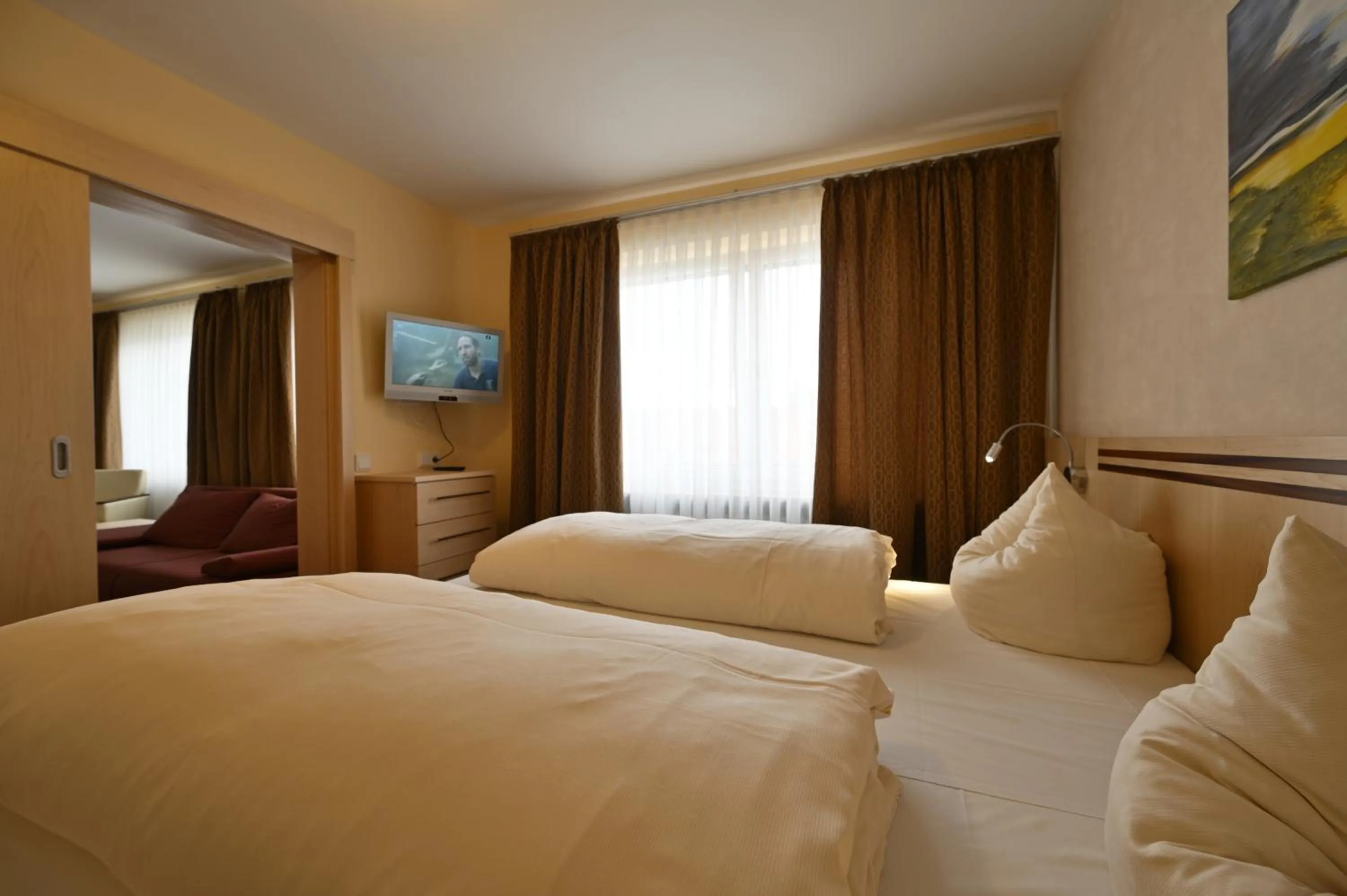 Bed in Hotel Apollo Garni