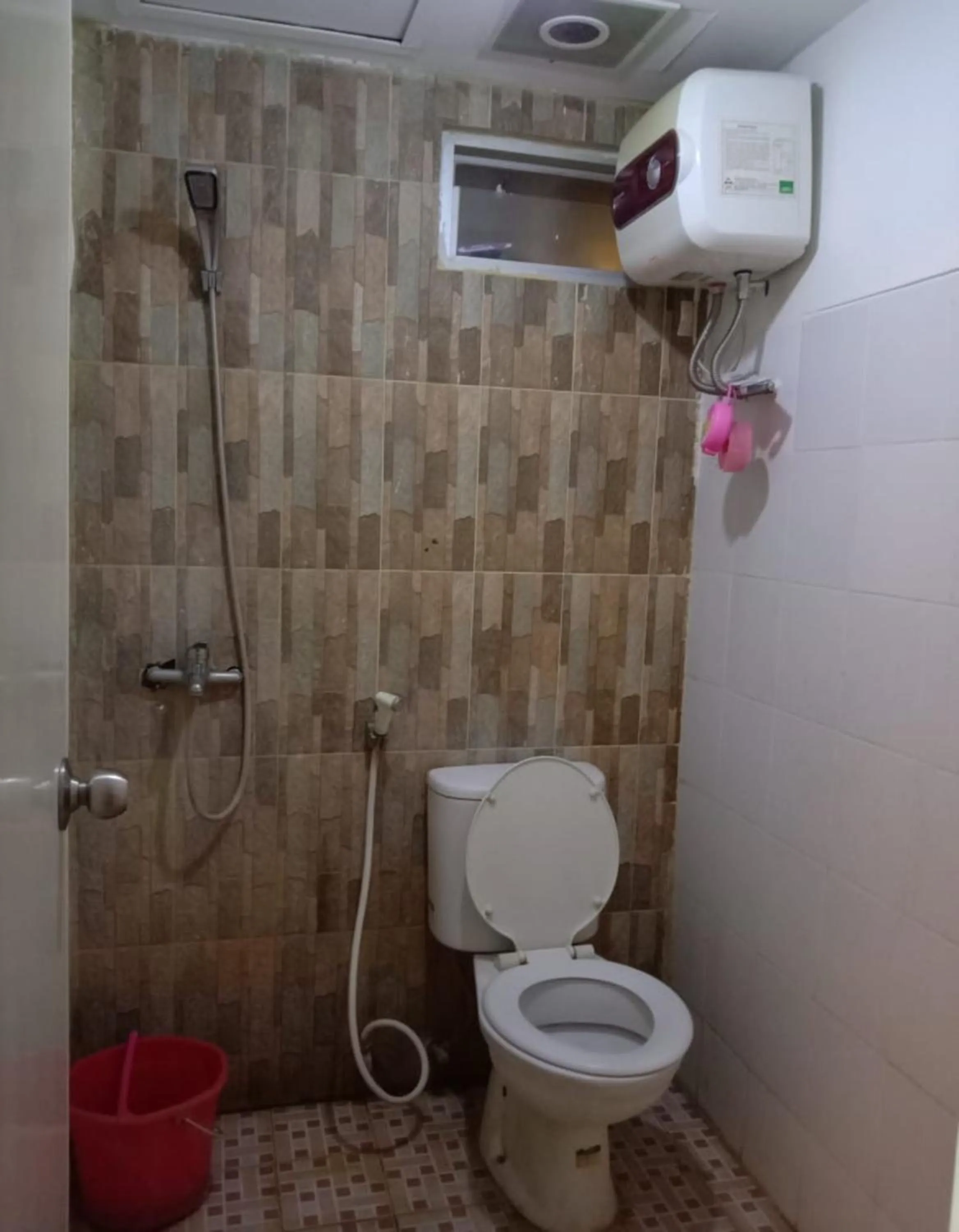 Bathroom in The Suites Metro Apartment by NFO Property