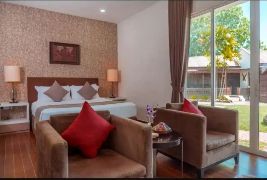 Seating area, Bed in Shah's Beach Resort Melaka