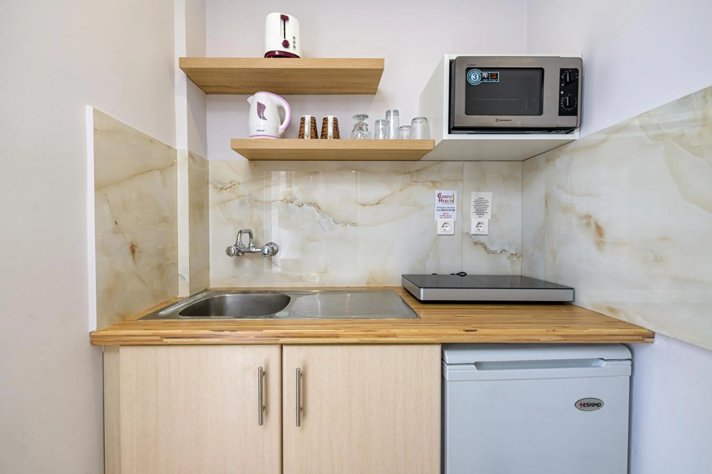 Kitchen or kitchenette in KORINA APART HOTEL KAVOS