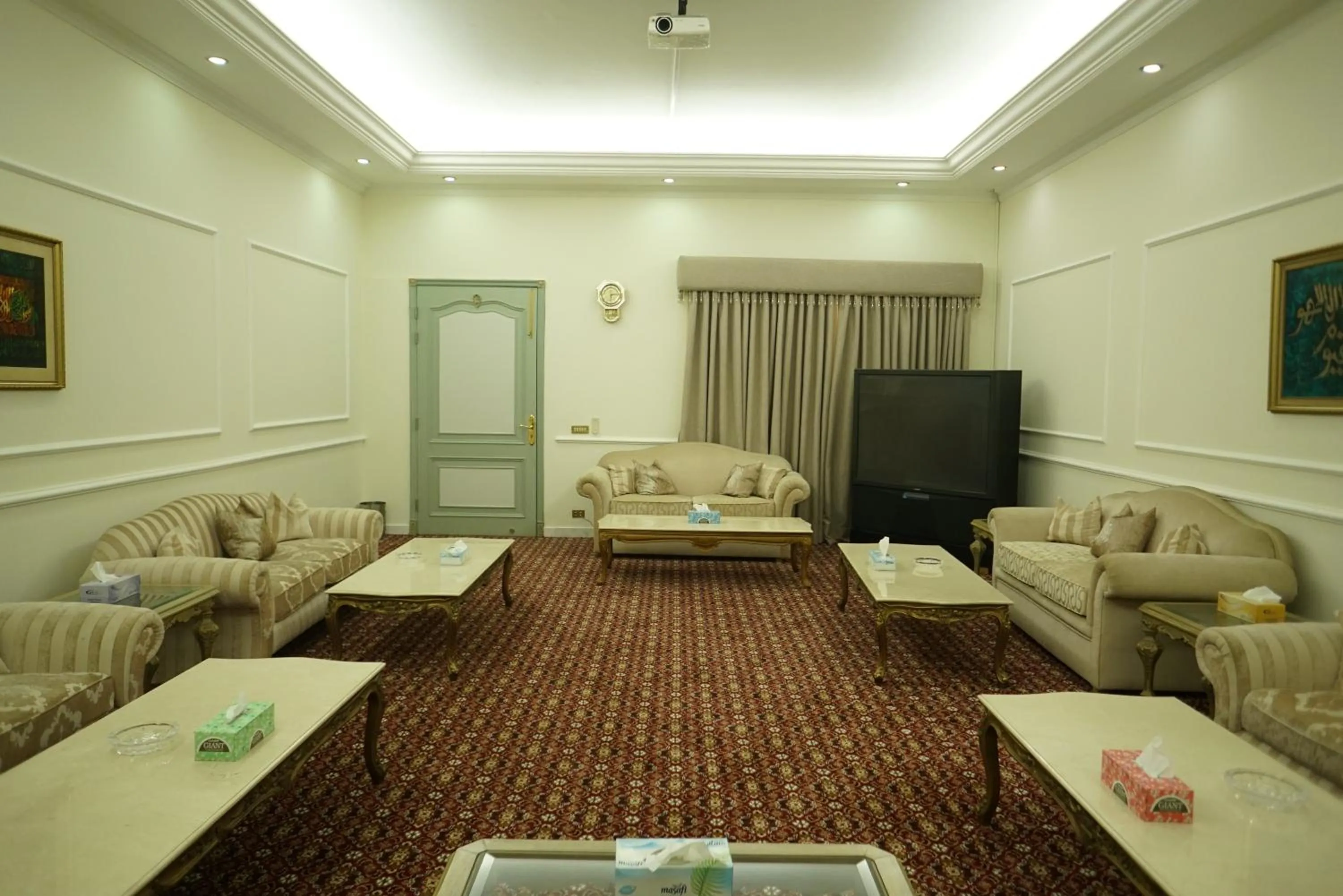 Communal lounge/ TV room in Etihad Club by Faletti's Hotel