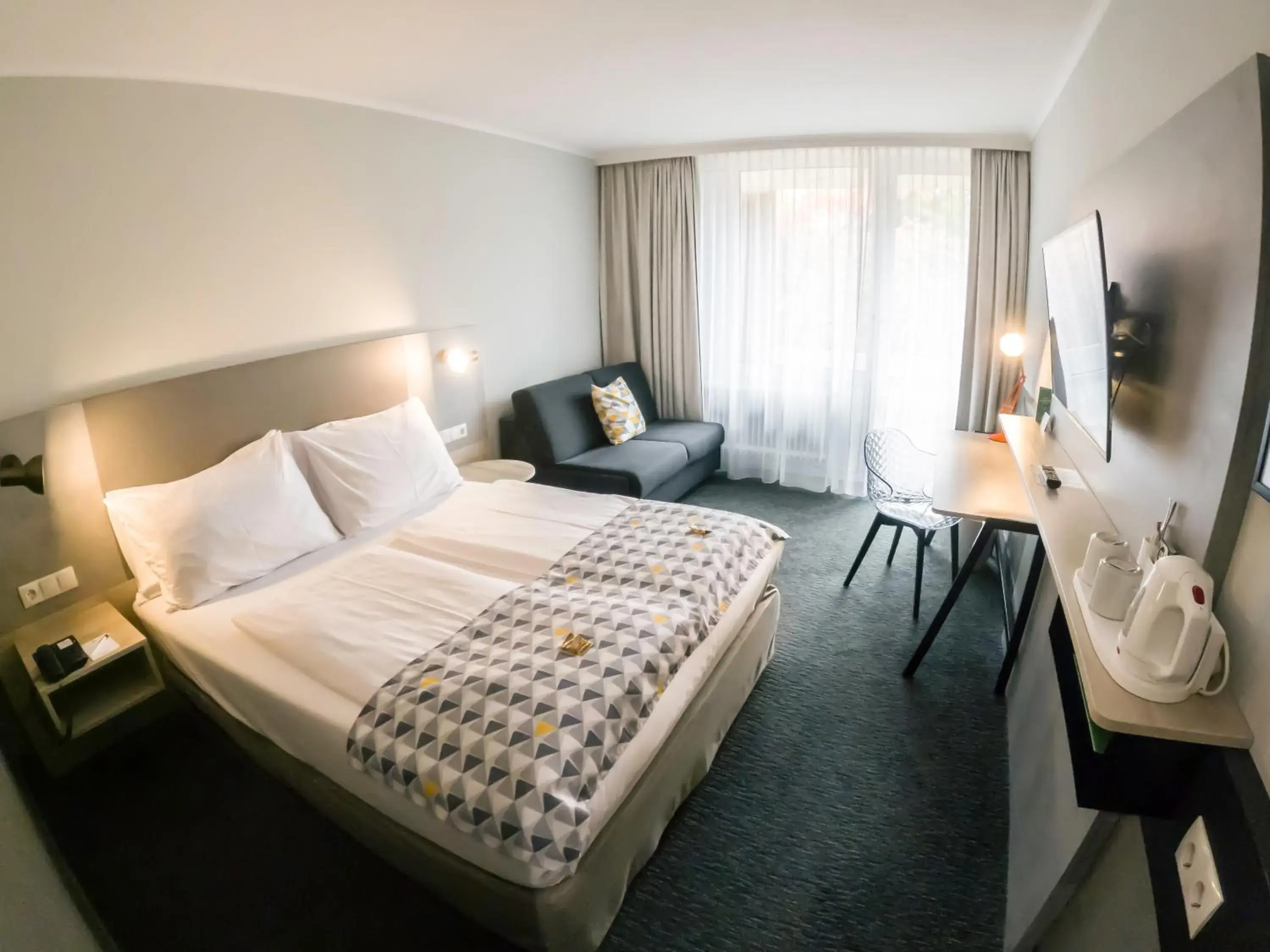 Standard Queen Room with Sofa Bed and Balcony in Holiday Inn Munich - South by IHG Standard Queen Room with Sofa Bed and Balcony in Holiday Inn Munich - South by IHG