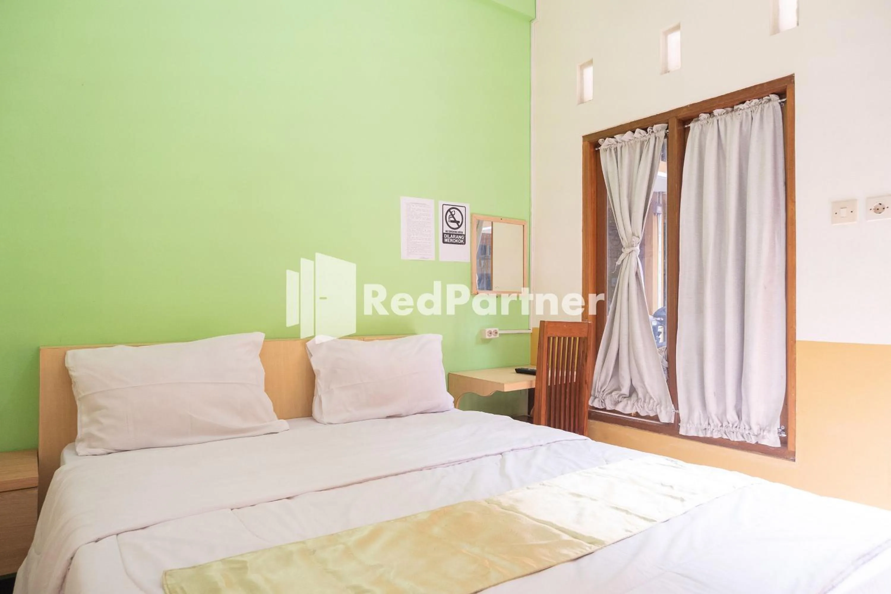 Bedroom, Bed in Wisma Handayani Syariah RedPartner near RSUD Wonosari