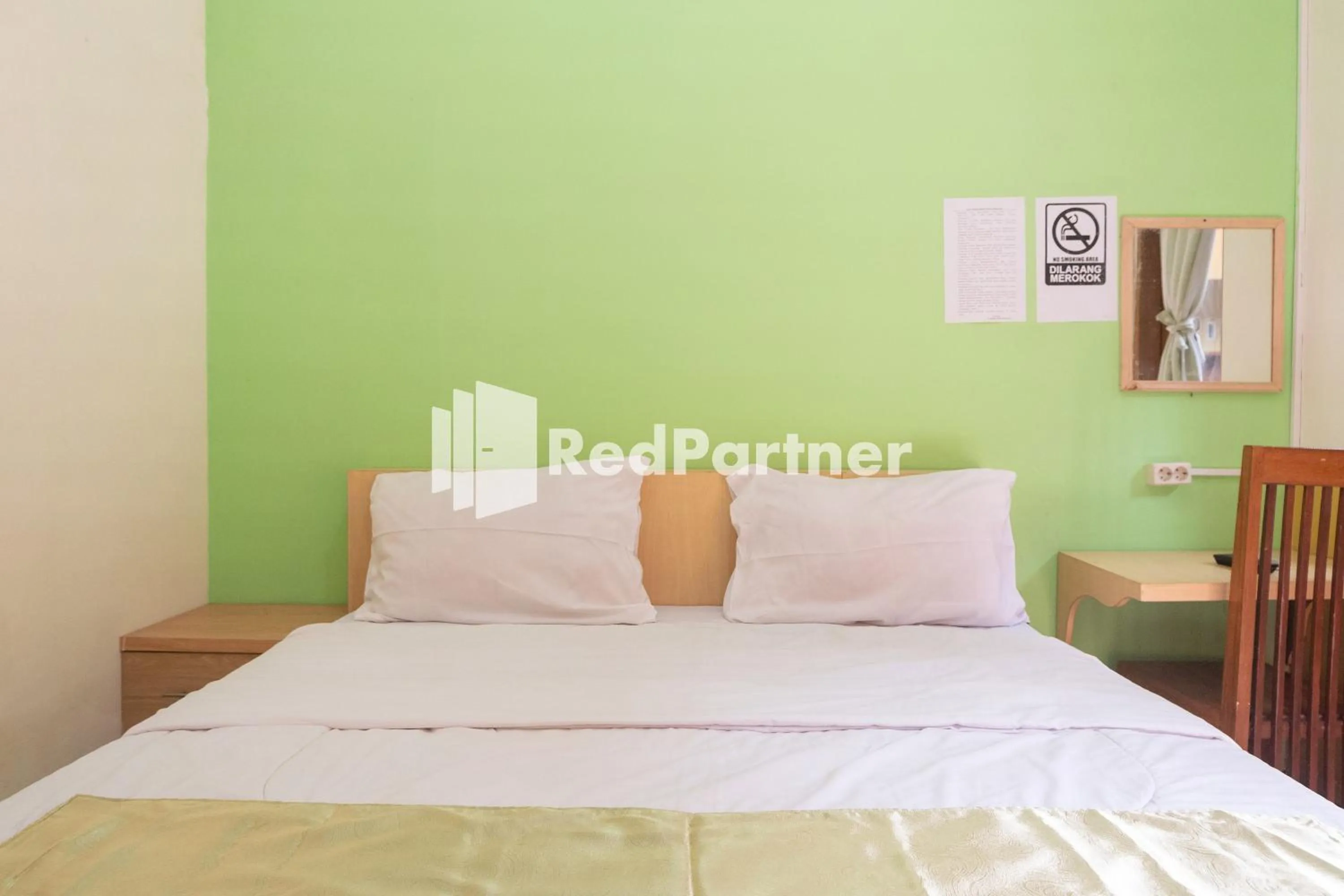 Bedroom, Bed in Wisma Handayani Syariah RedPartner near RSUD Wonosari
