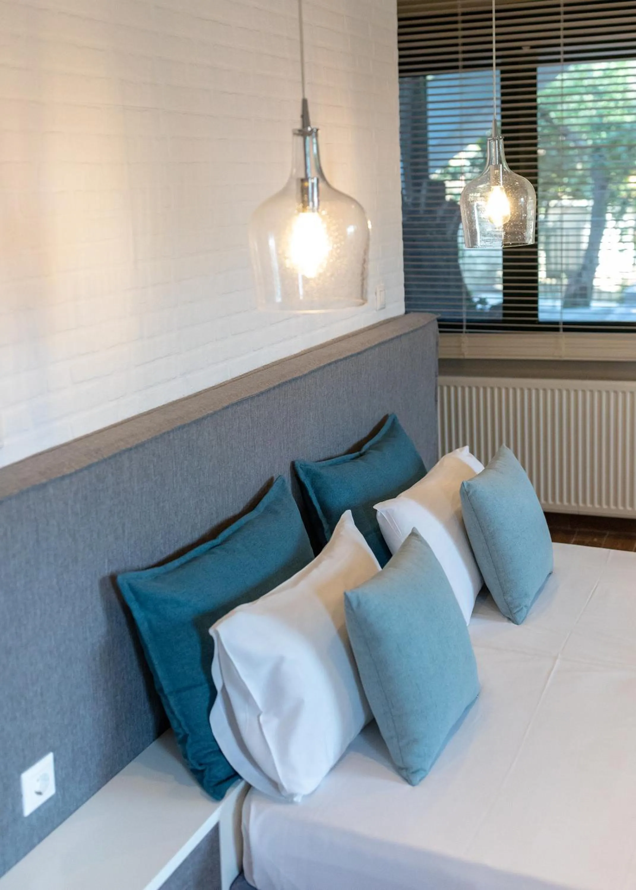 Bed in Ampoulos Rooms & Apartments