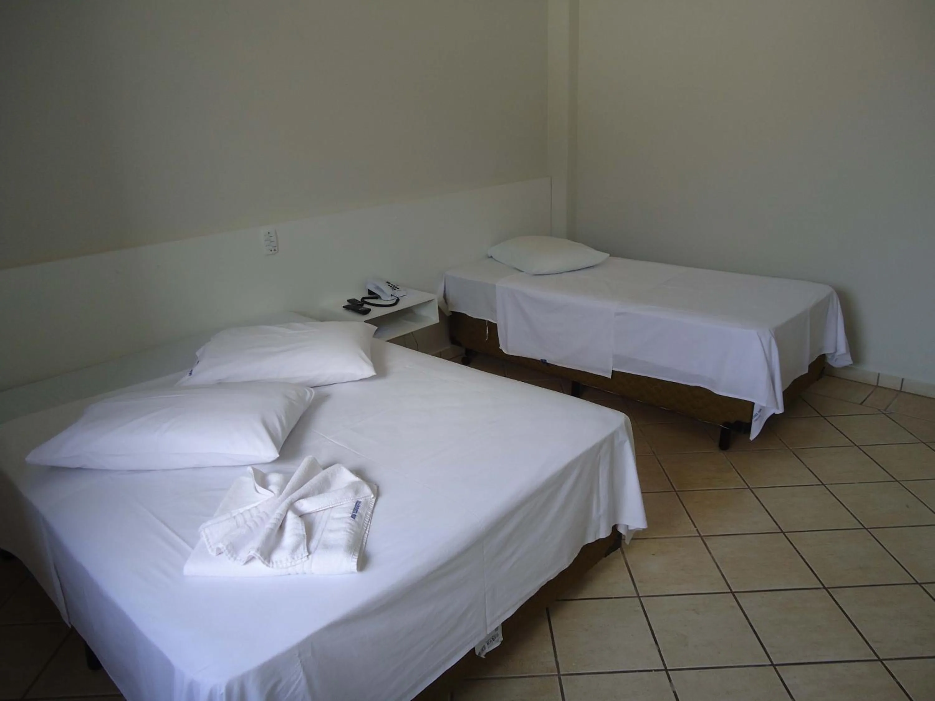 Bed in Big Executive Hotel