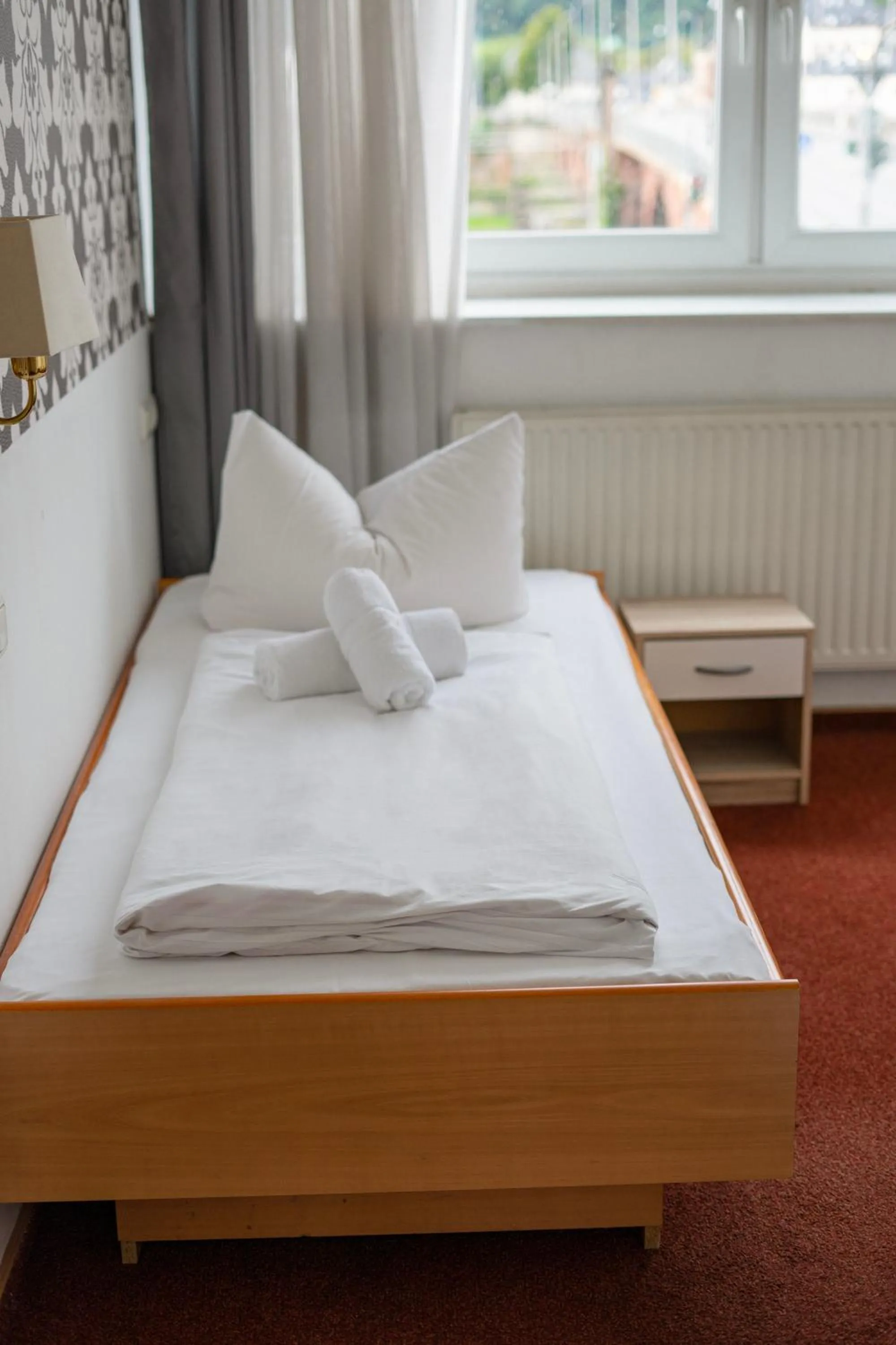 Bed in Self-Check-In Hotel Constantin