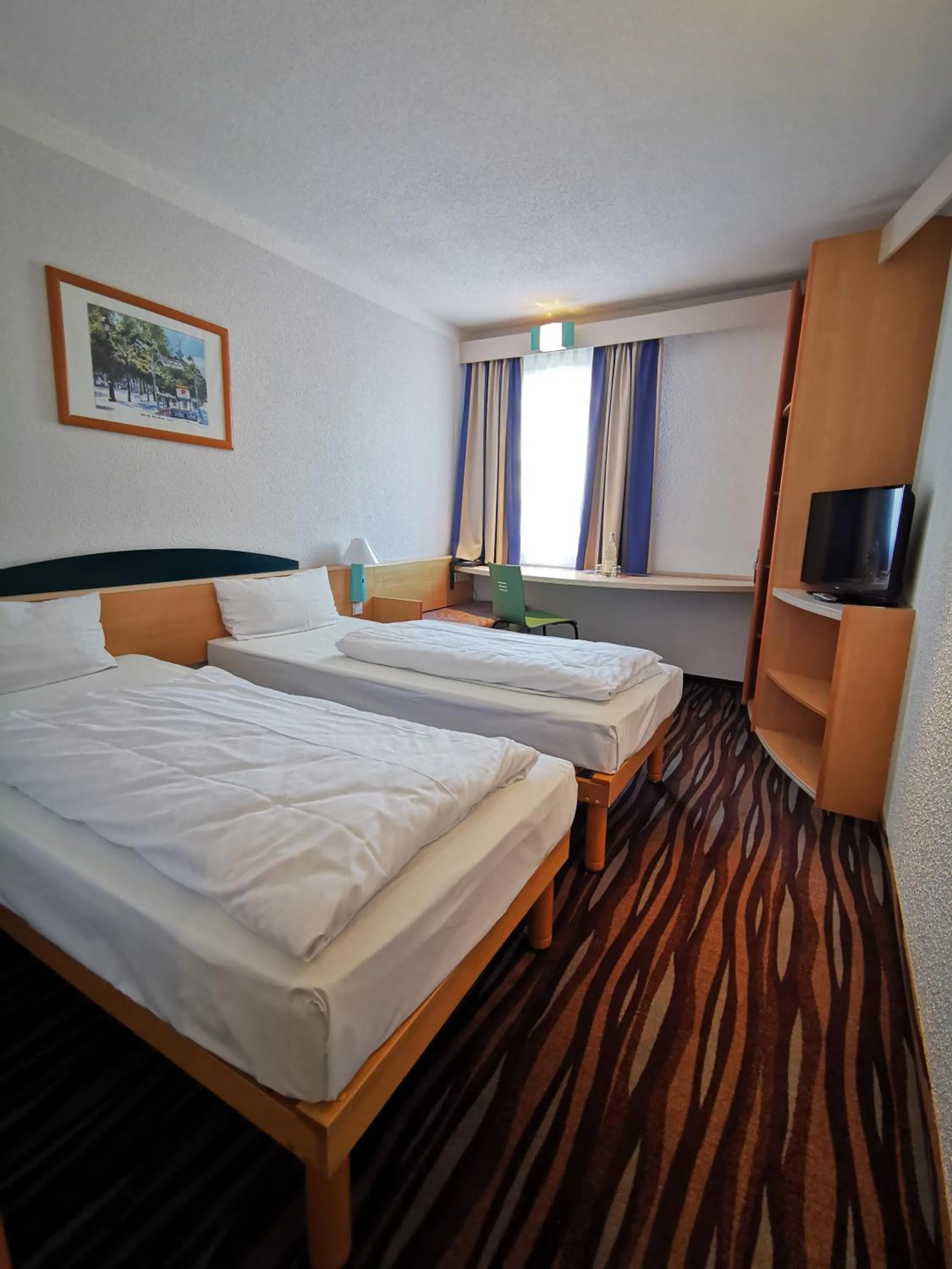 Bed in Plaza Inn Berlin Süd Ludwigsfelde