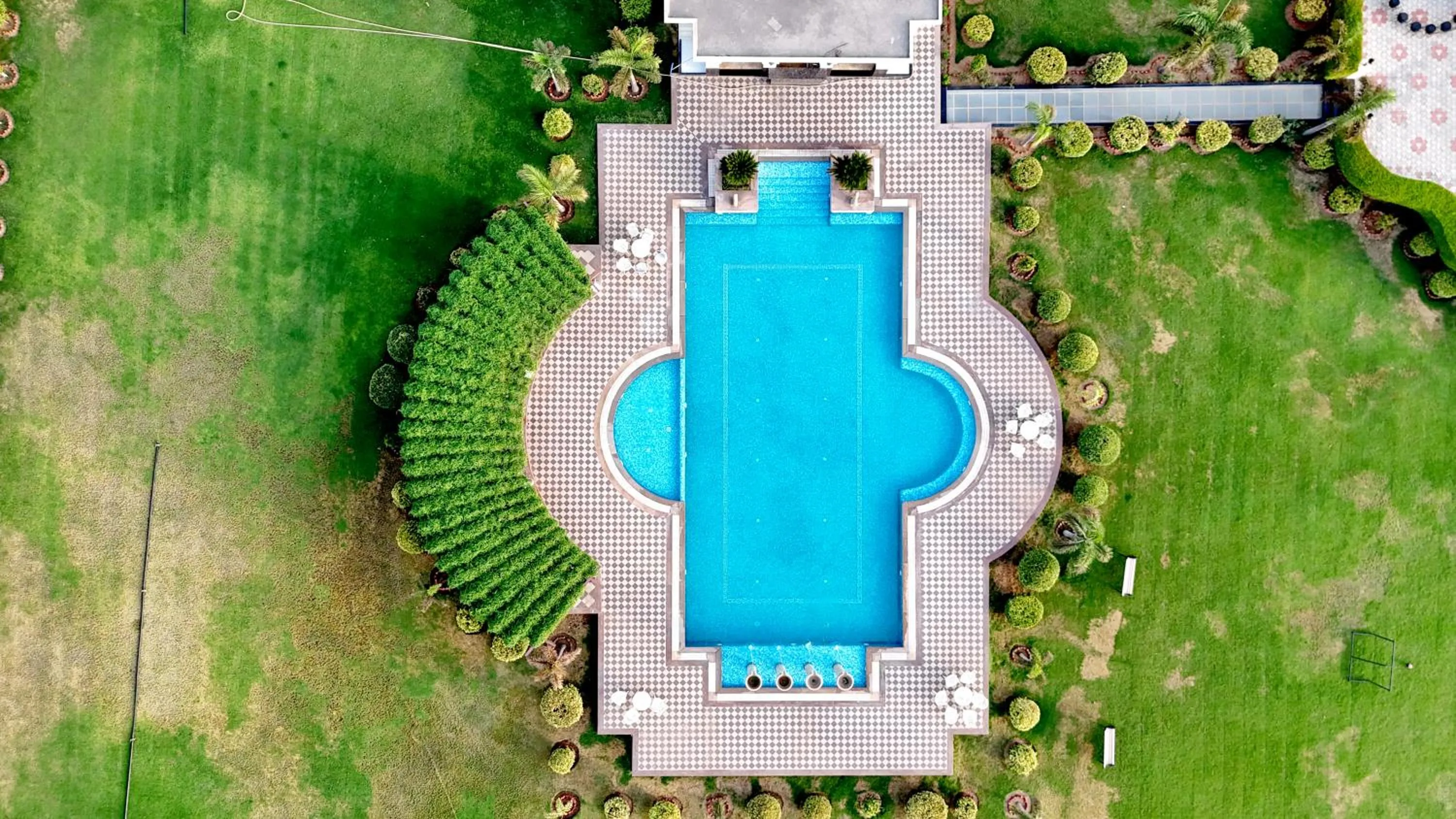 Pool view in Umaid Farm Resort- A Legancy Vintage Stay In Jaipur