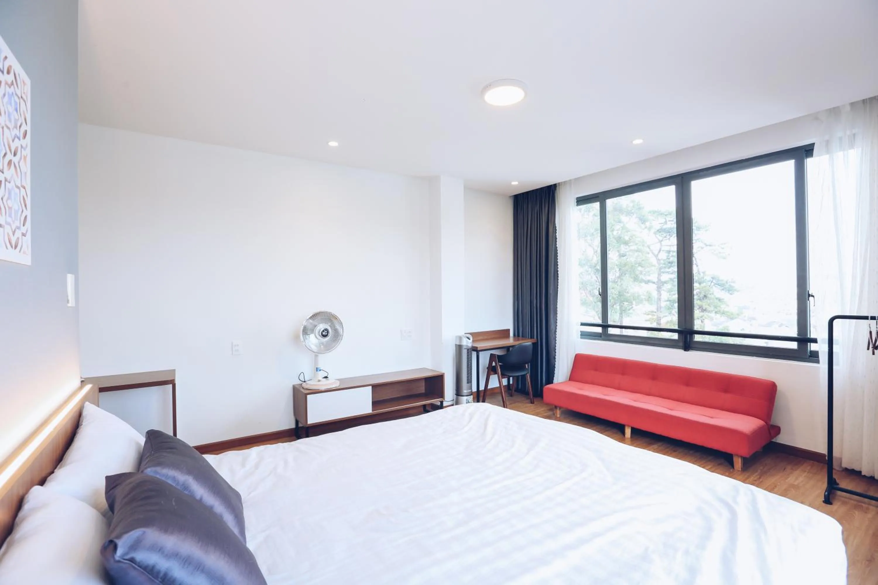 Bed in TTR Studio Apart Hotel