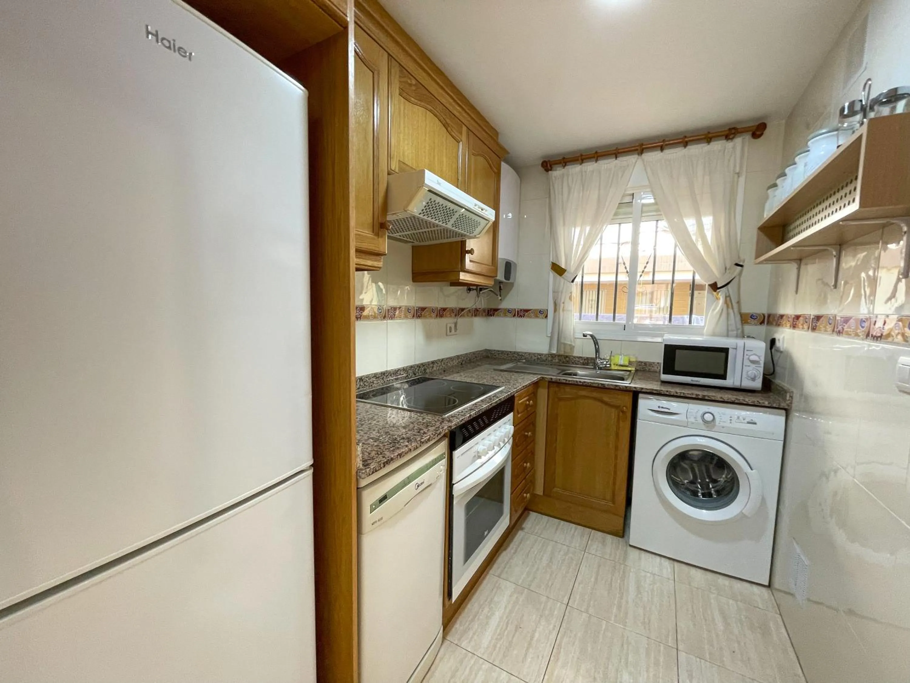 Kitchen or kitchenette in Apartamentos Caribe Marina D’Or 3000