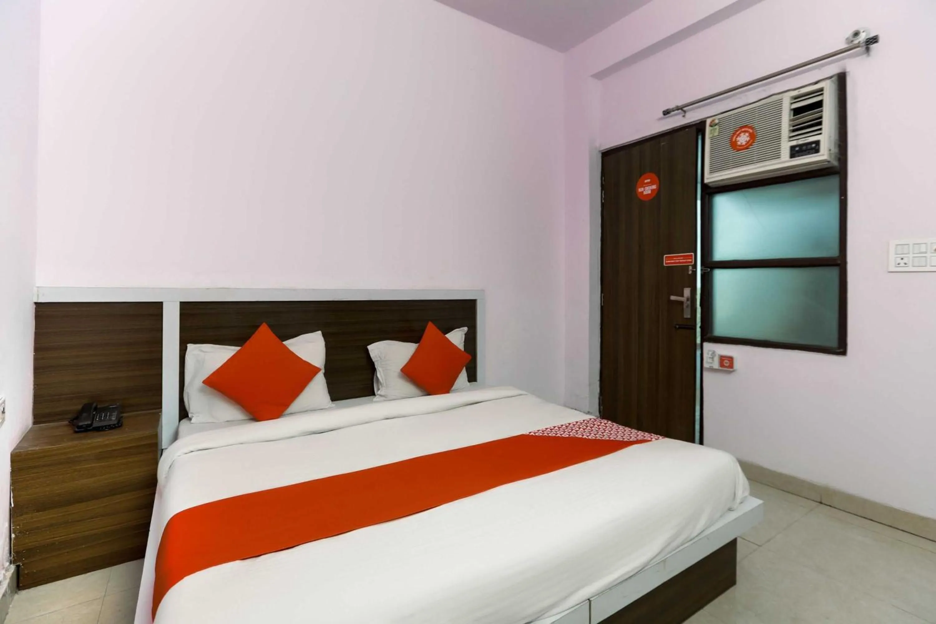 Bedroom in Hotel O Noida Villa