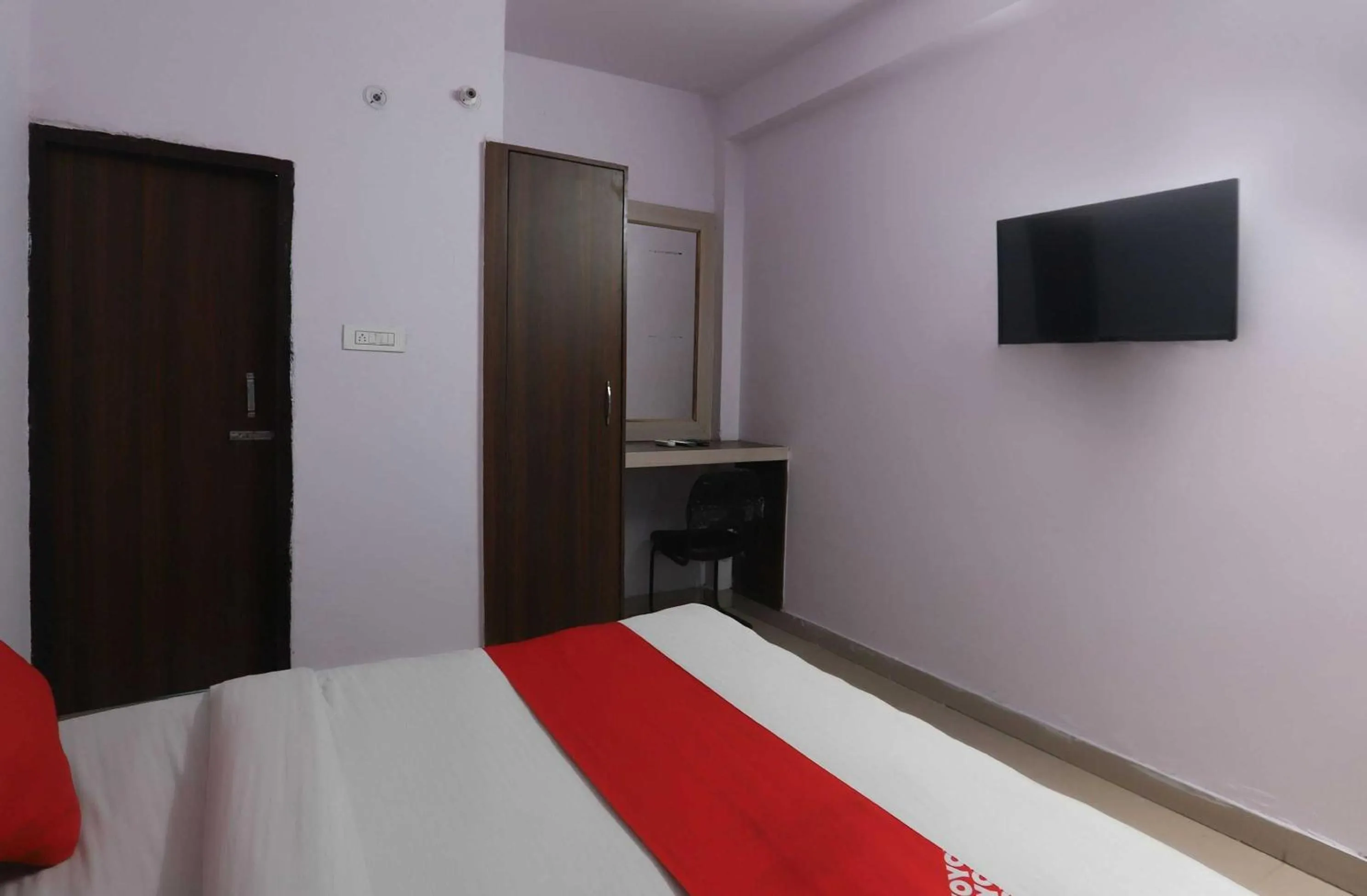 Bedroom in Hotel O Noida Villa