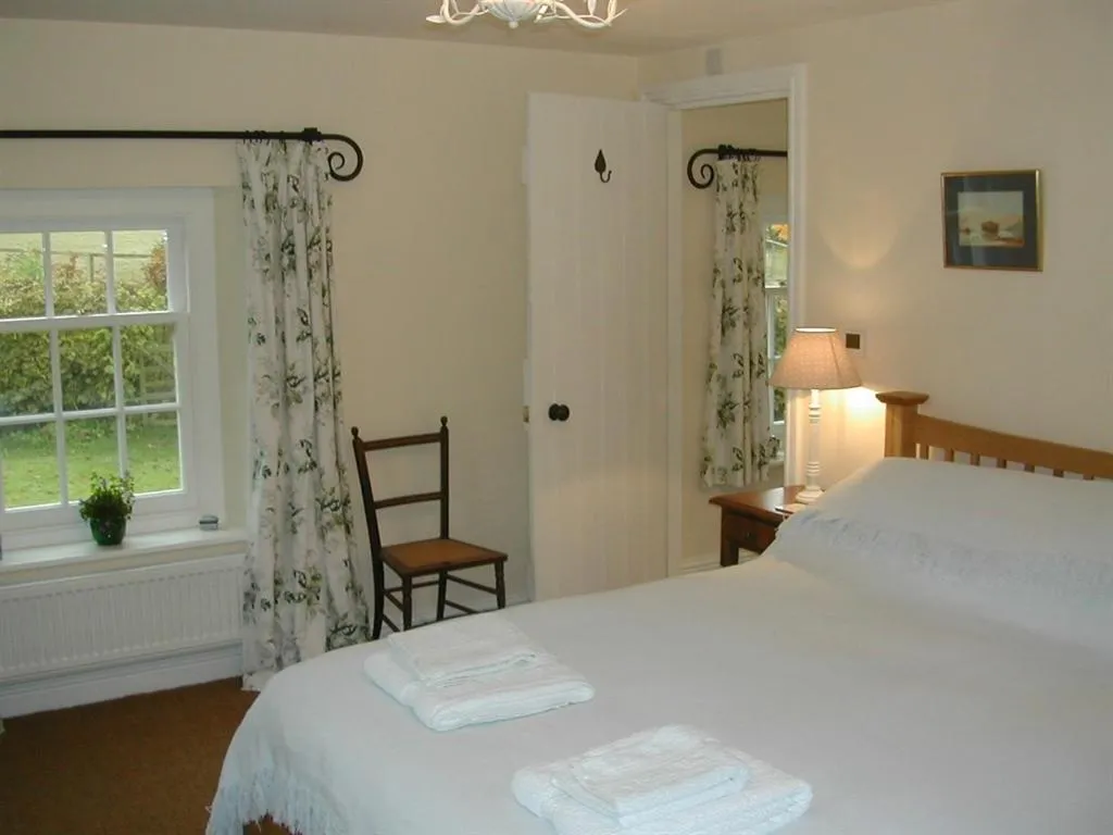 Bedroom, Bed in Alltybrain Farm Cottages