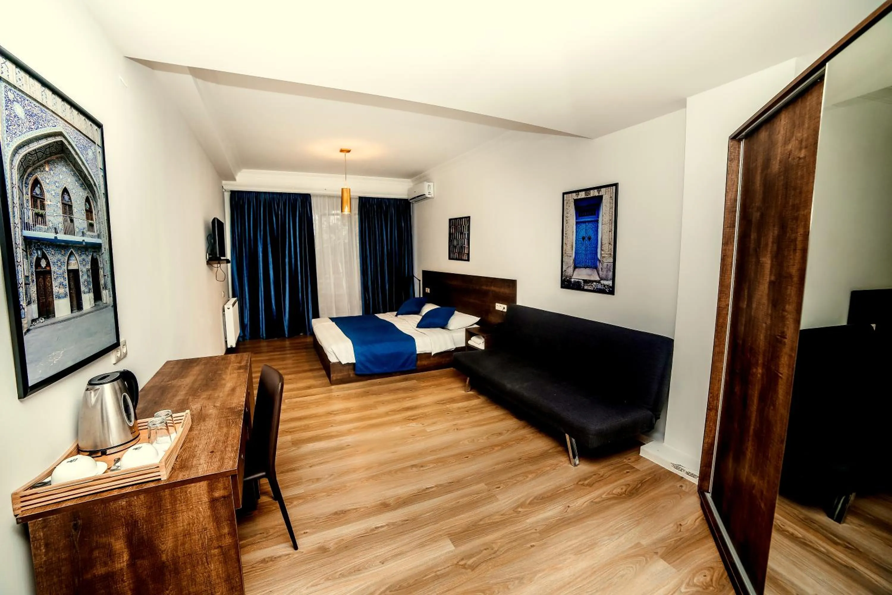 Communal lounge/ TV room, Bed in Tbilisi View Hotel