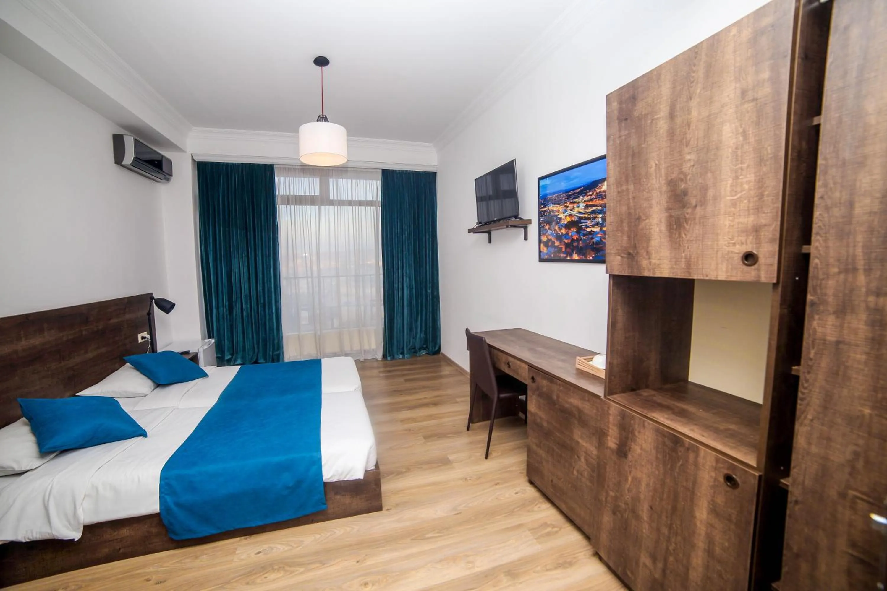 Communal lounge/ TV room, Bed in Tbilisi View Hotel