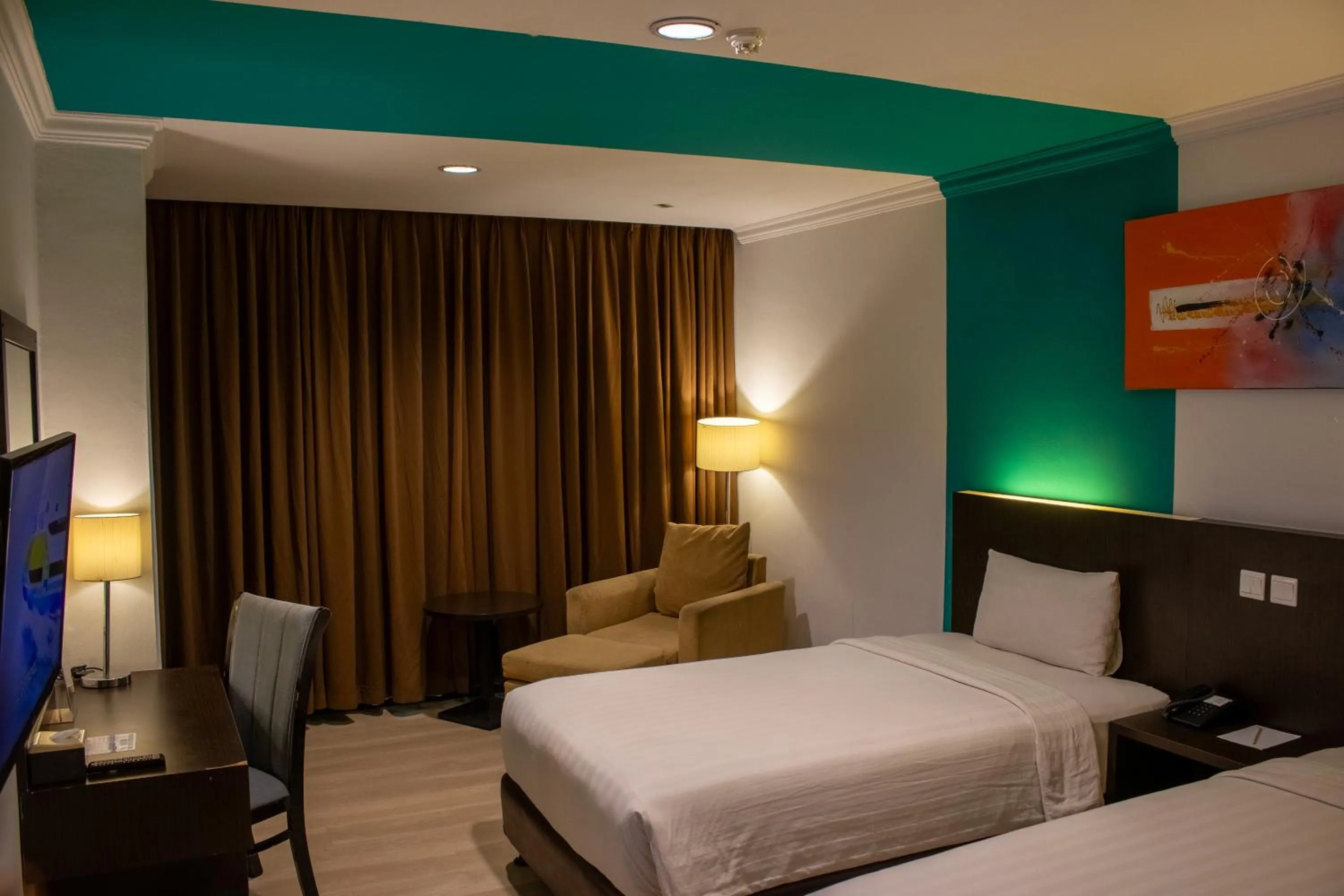 Bed in King's Hotel Nagoya Batam