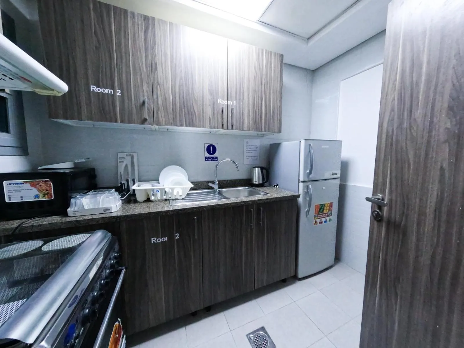 Kitchen or kitchenette in Warsan Star Residence - Home Stay