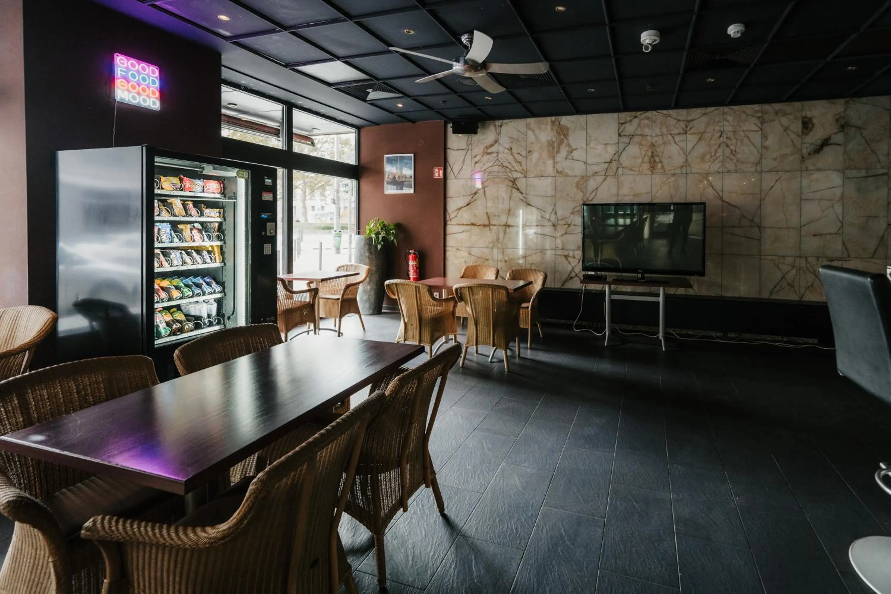 Communal lounge/ TV room in Savoy Hotel