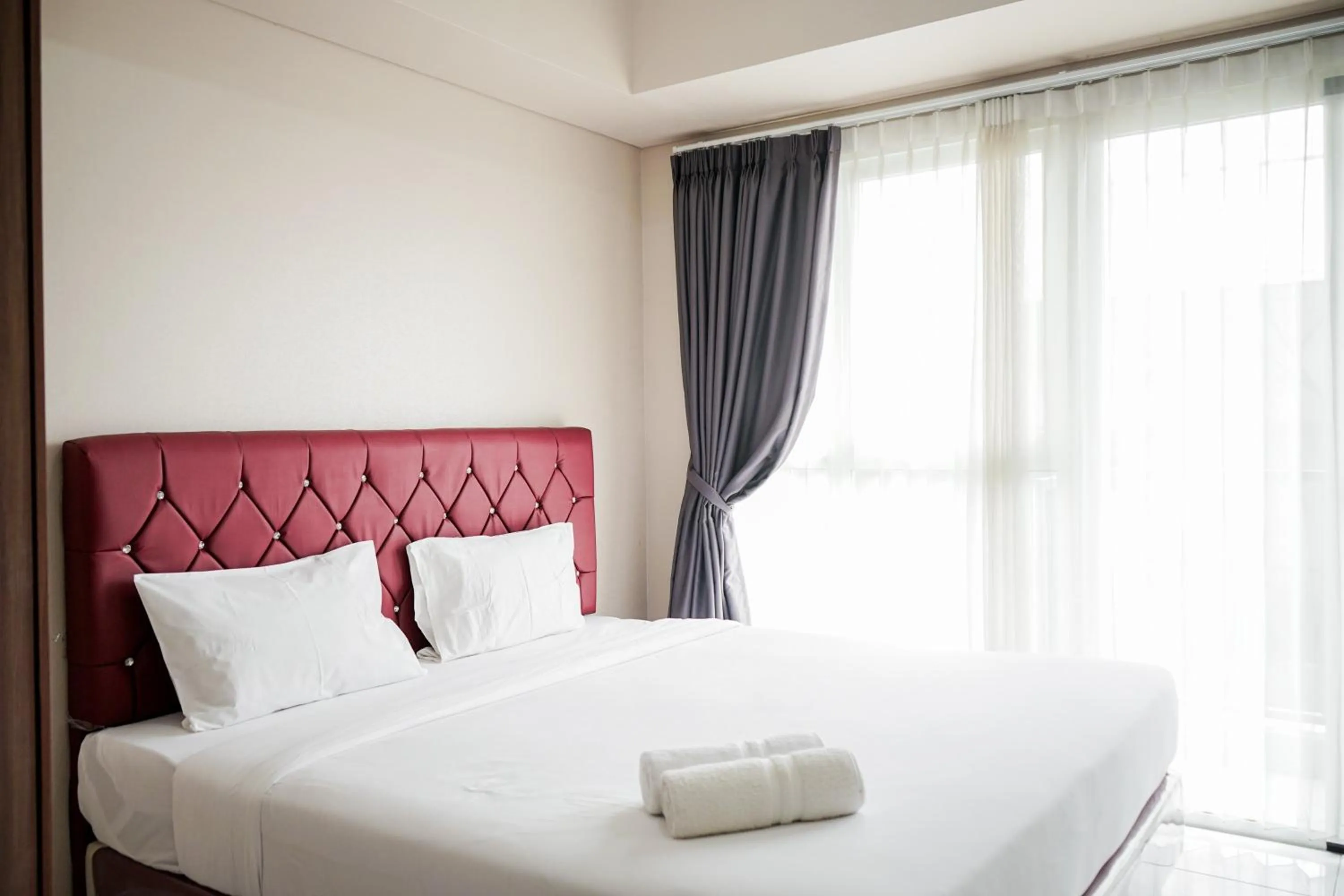 Bedroom, Bed in Cozy Minimalist Studio at Casa de Parco Apartment By Travelio