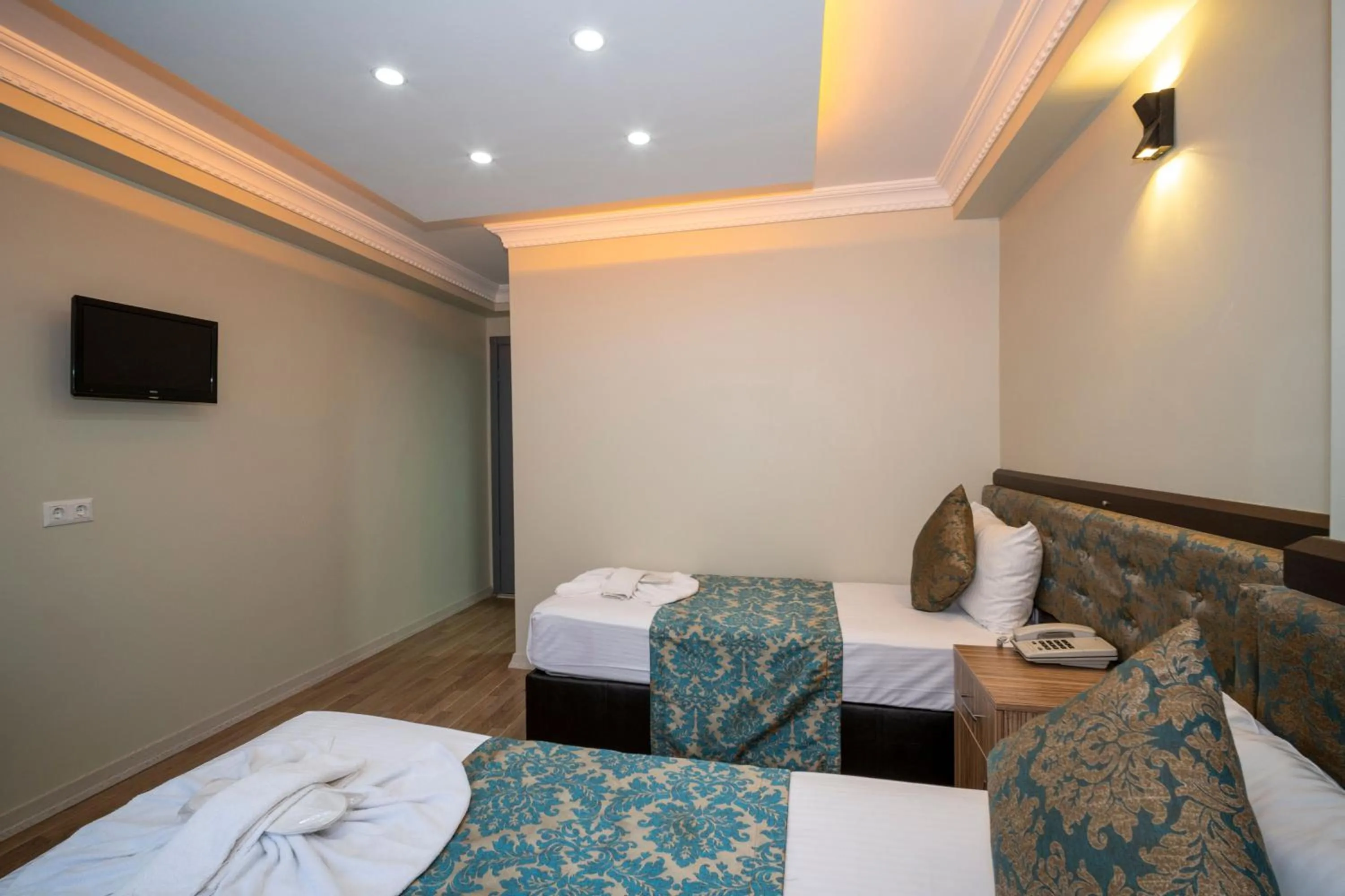 Bed in Hotel Simper