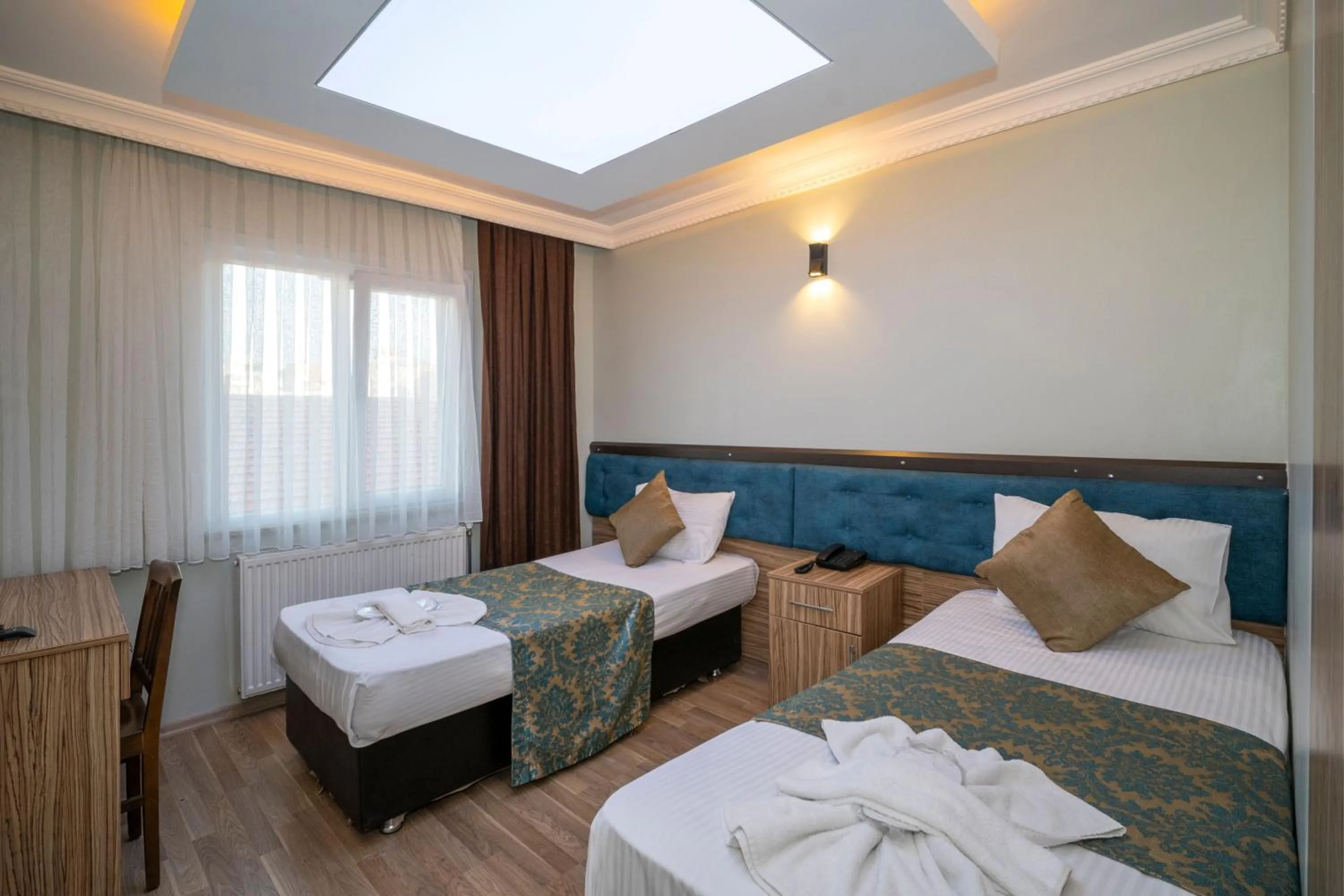 Bed in Hotel Simper