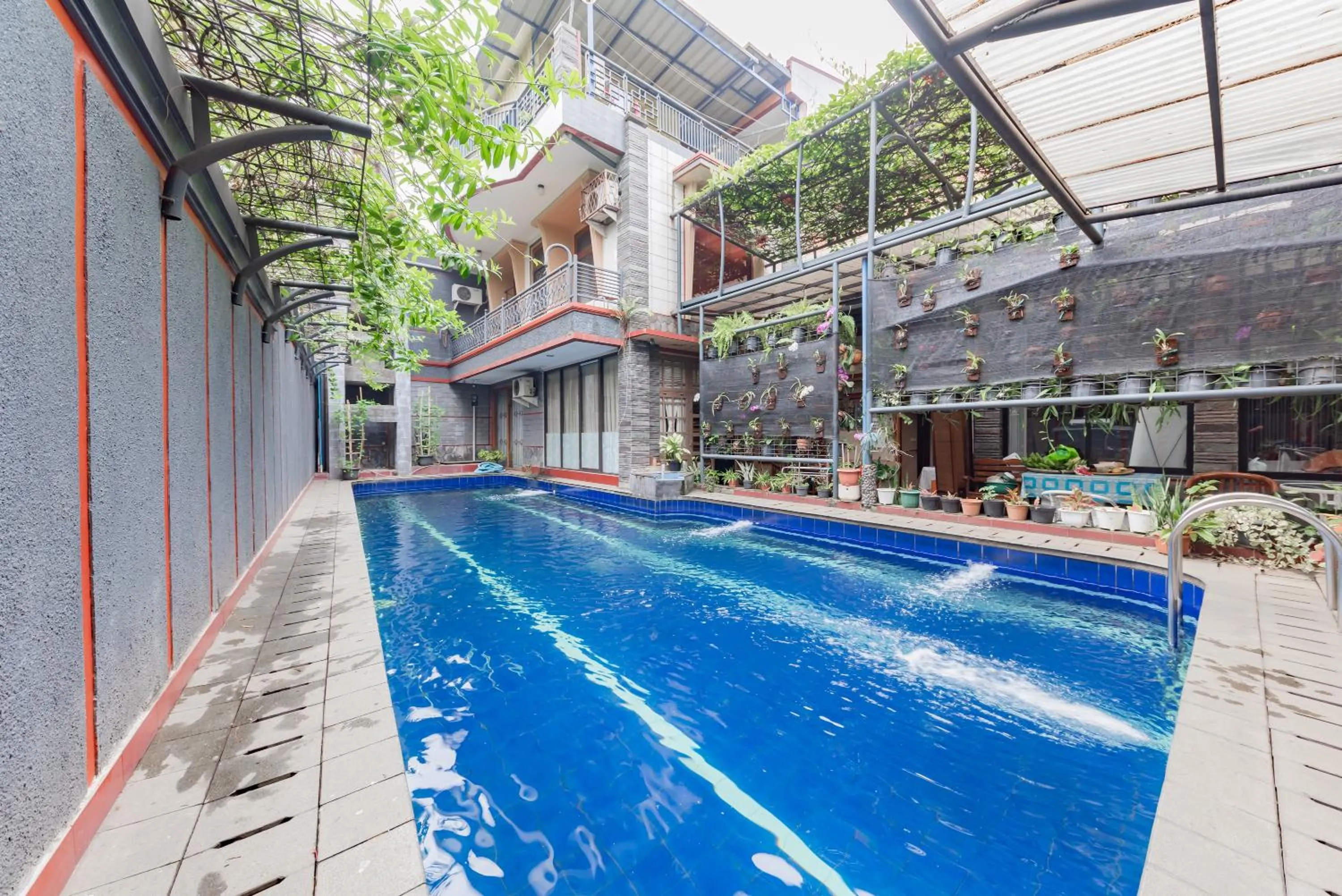 Pool view in Urbanview Hotel Villa Surya Bandung