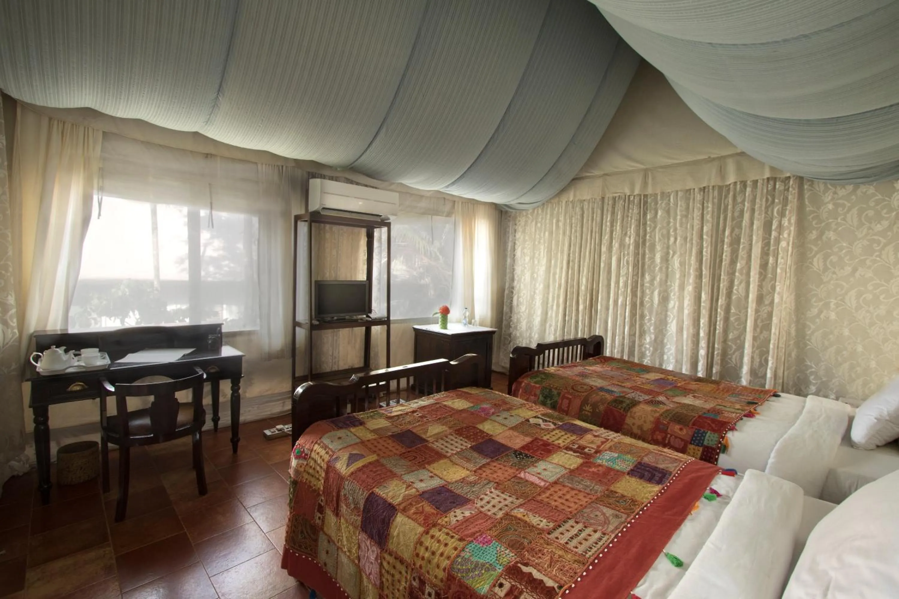 Bed in Grassroots Wayanad, Valley-view Tents