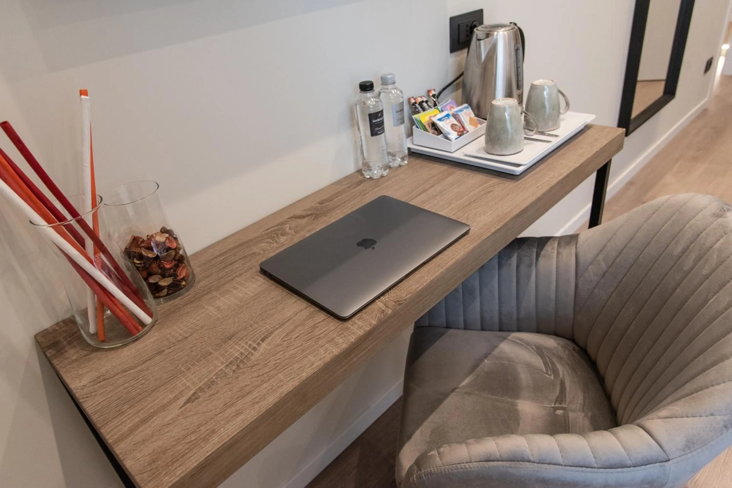 Seating area in XXIV Domus Luxury Suites