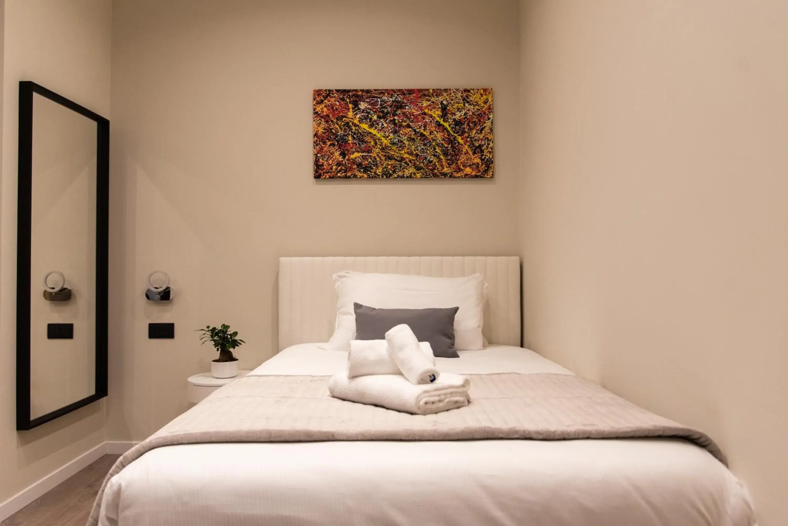 Bed in XXIV Domus Luxury Suites Bed in XXIV Domus Luxury Suites
