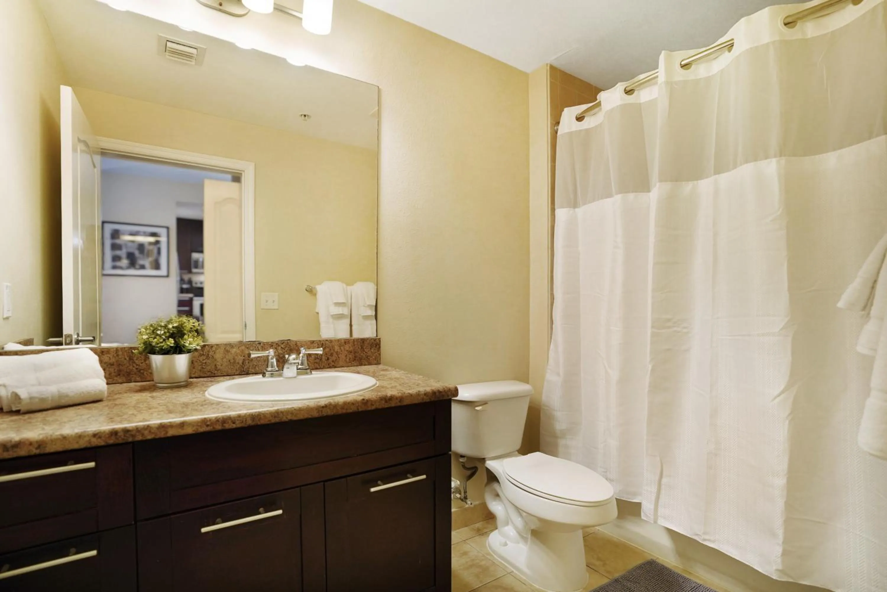 Bathroom in Dharma Home Suites South Miami at Red Road Commons