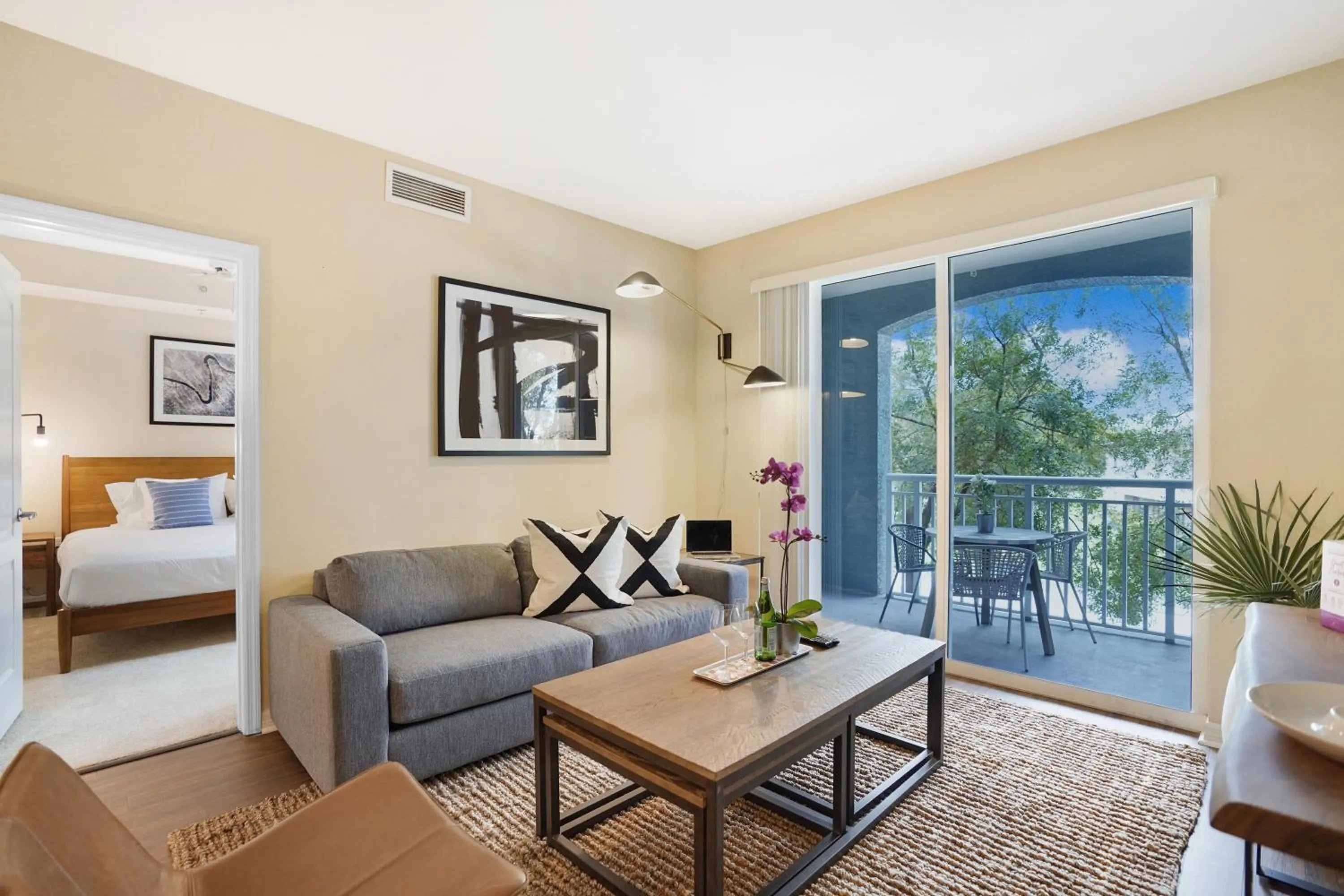 Living room, Bed in Dharma Home Suites South Miami at Red Road Commons