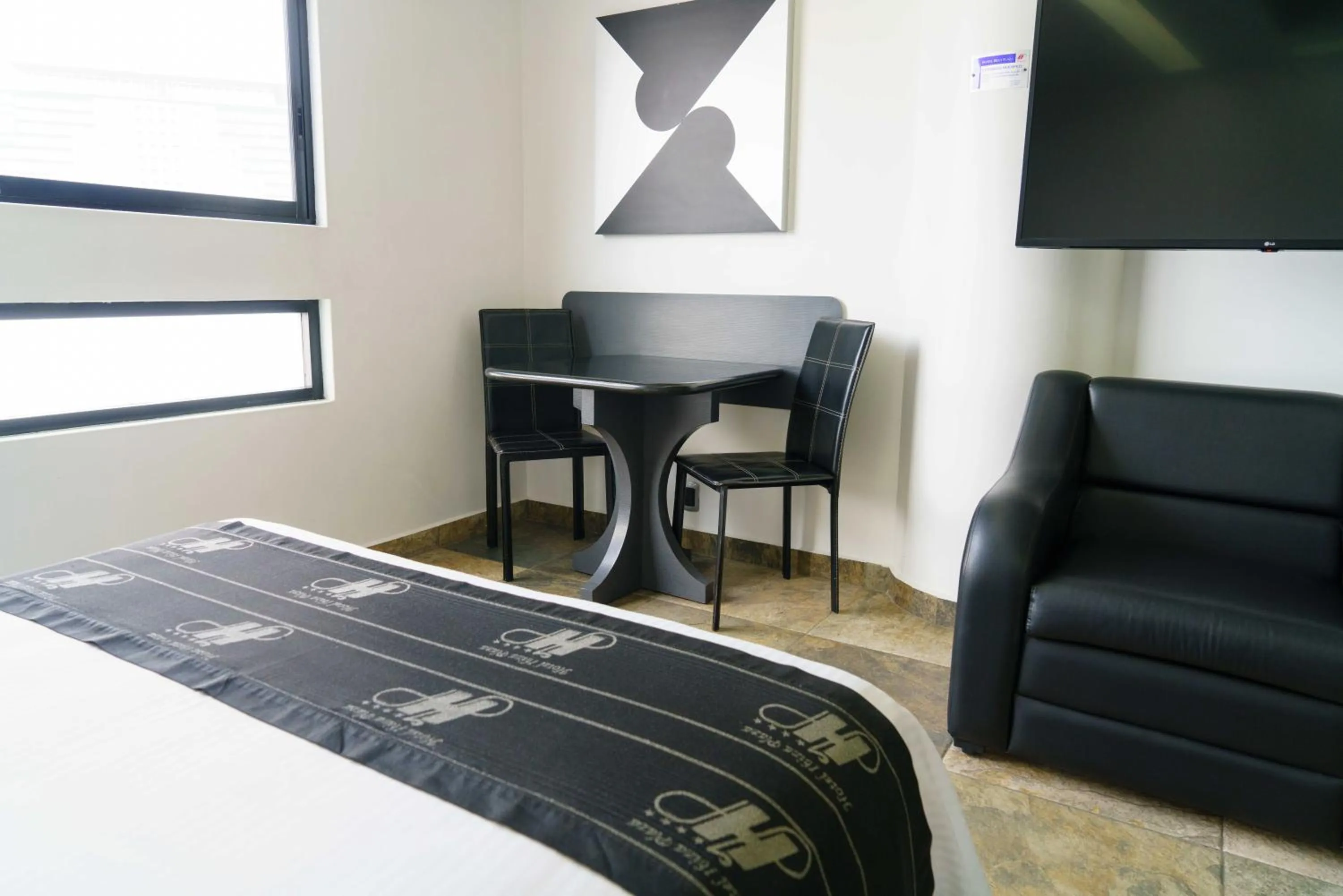 Living room, Bed in Hotel Ibiza Plaza