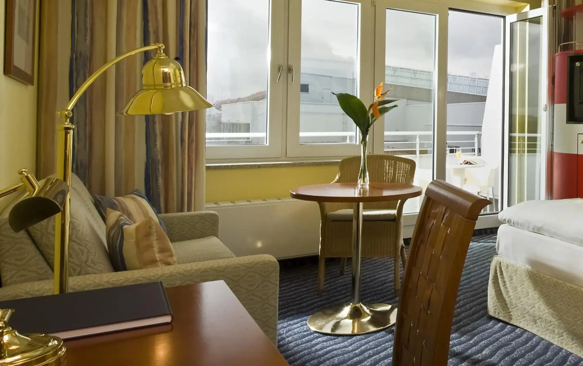 Seating area, Bed in Wyndham Stralsund HanseDom Seating area, Bed in Wyndham Stralsund HanseDom