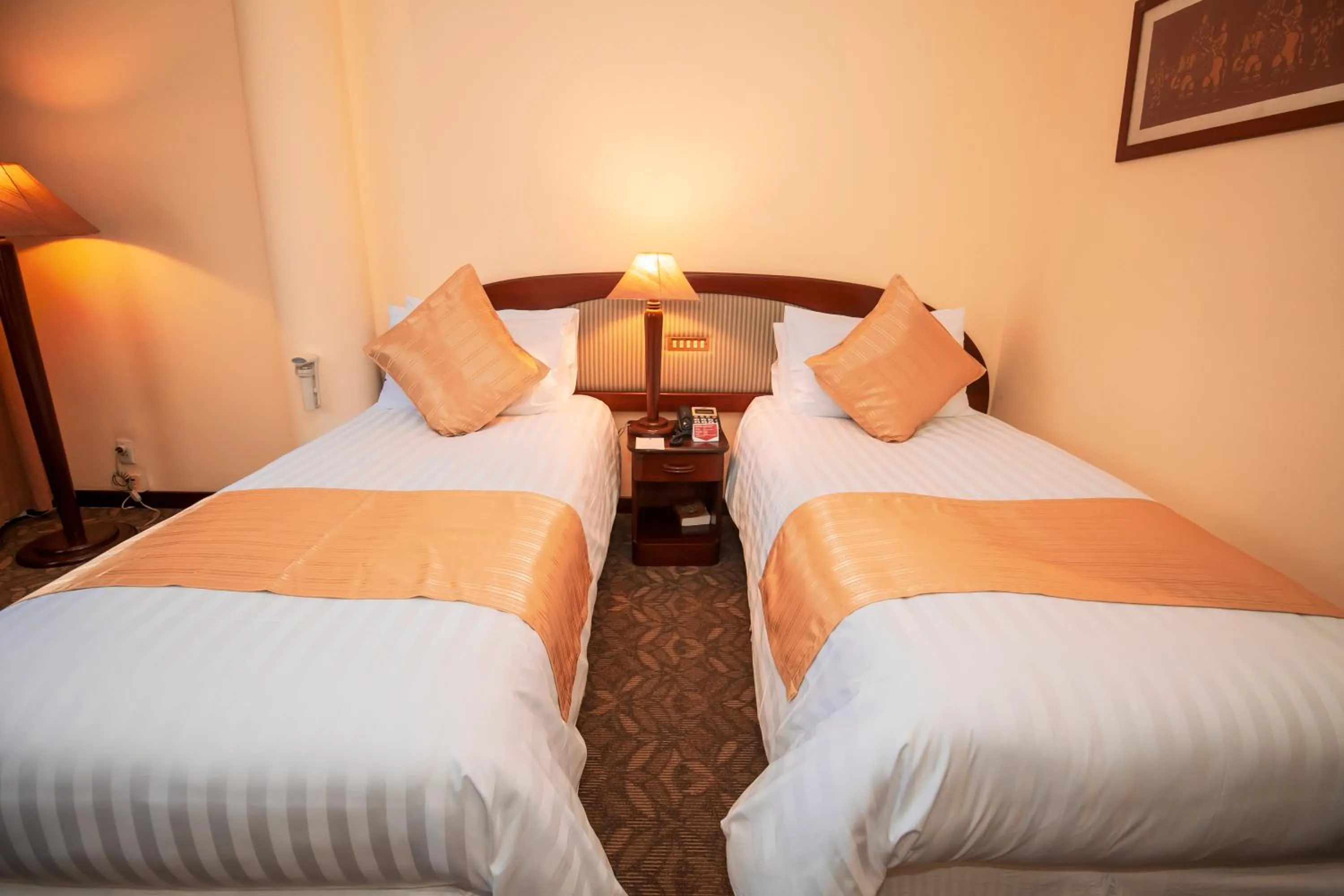 Bed in LAOTEL VIENTIANE